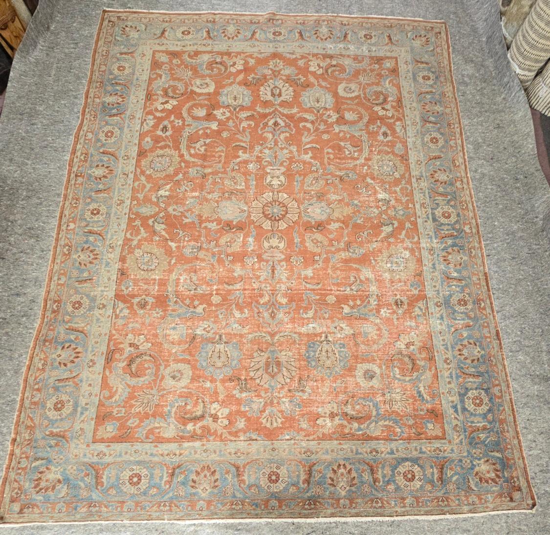 Infuse your home with timeless elegance and rich Persian heritage with this antique Persian Mahal rug, dating back to circa 1920. Measuring 9 x 12 feet, this exquisite rug embodies the artistry and precision for which Mahal Weavers are renowned. Its