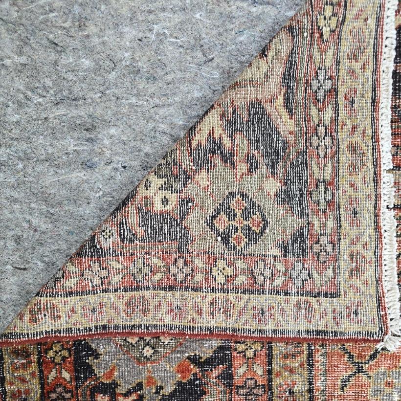 Discover the charm and sophistication of this antique Persian Mahal rug, a rare hand-knotted Persian area rug that showcases the rich heritage of Persian craftsmanship. This 10 x 11 foot masterpiece features intricate floral designs and vibrant yet