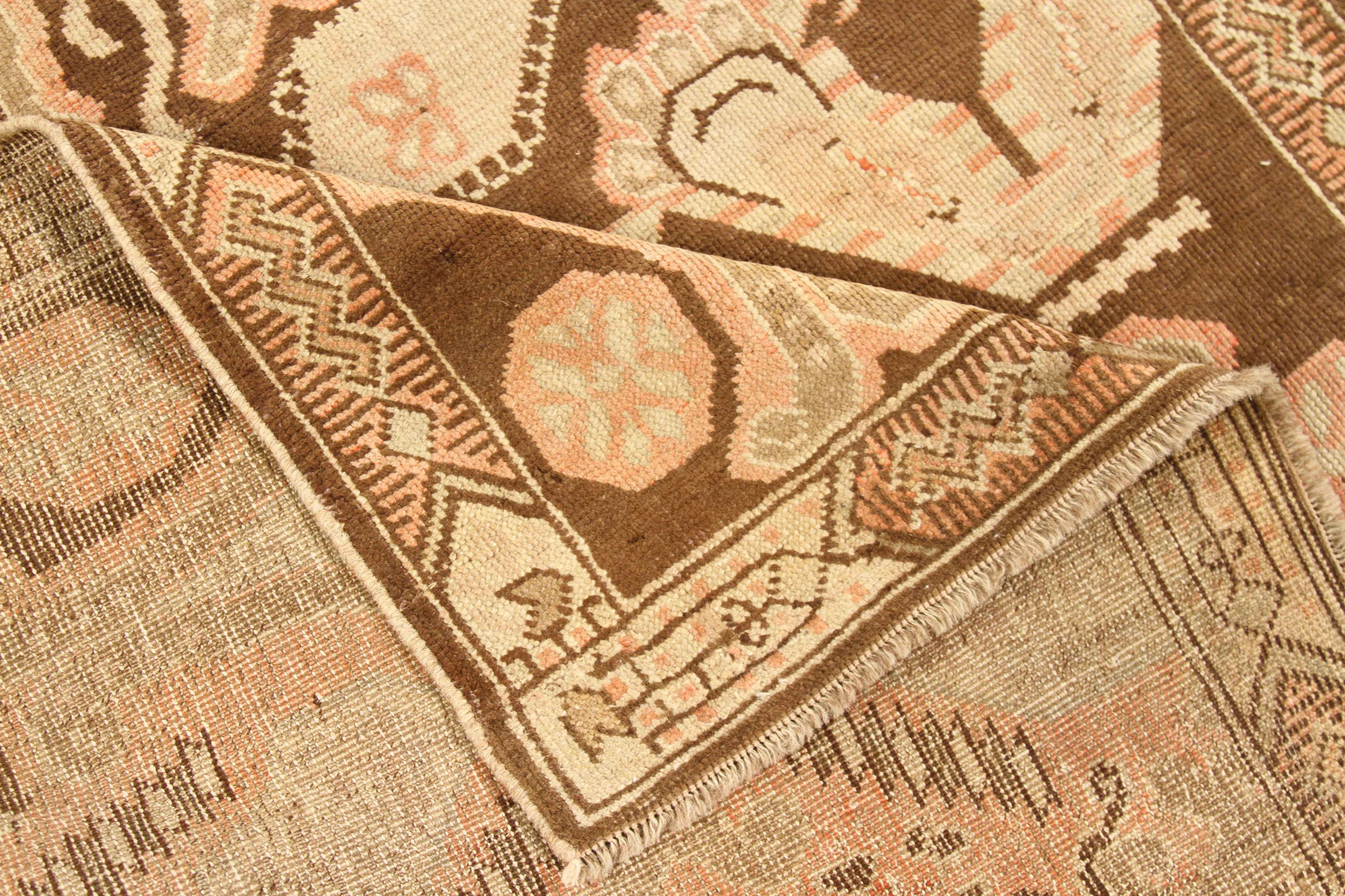 Antique rug made of handspun wool and organic dyes. The weaving and design followed Karabagh patterns that commonly depicted scarabs and ornate medallions. For color, it shows beige, green, brown, and red that gives off a rustic feel to the rug.