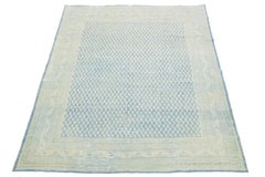 1920s Antique Persian Tabriz Wool Rug Featuring a Blue and Beige Allover Pattern