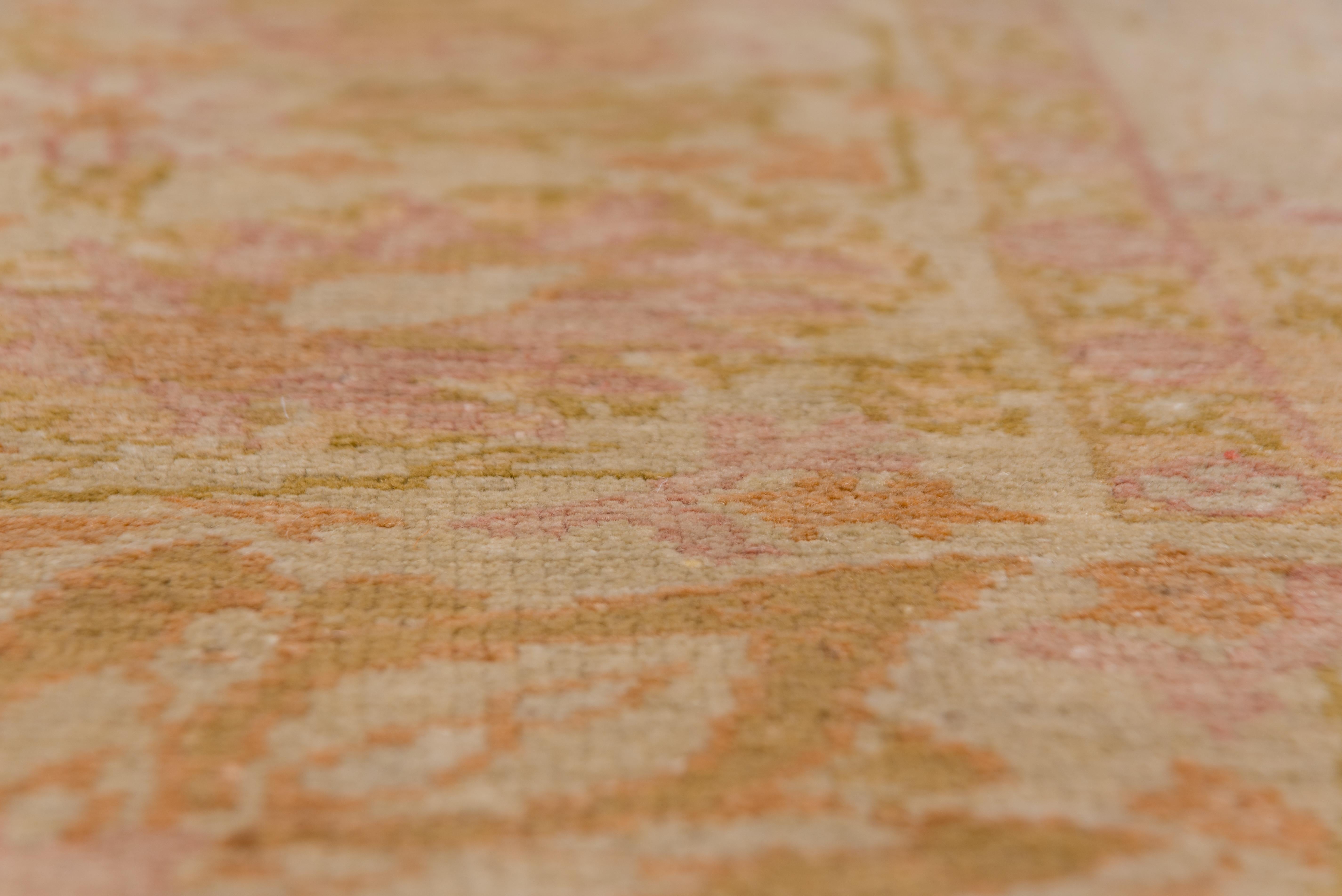 Hand-Knotted 1920s Antique Pink Oushak Carpet with a Curvilinear Medallion For Sale