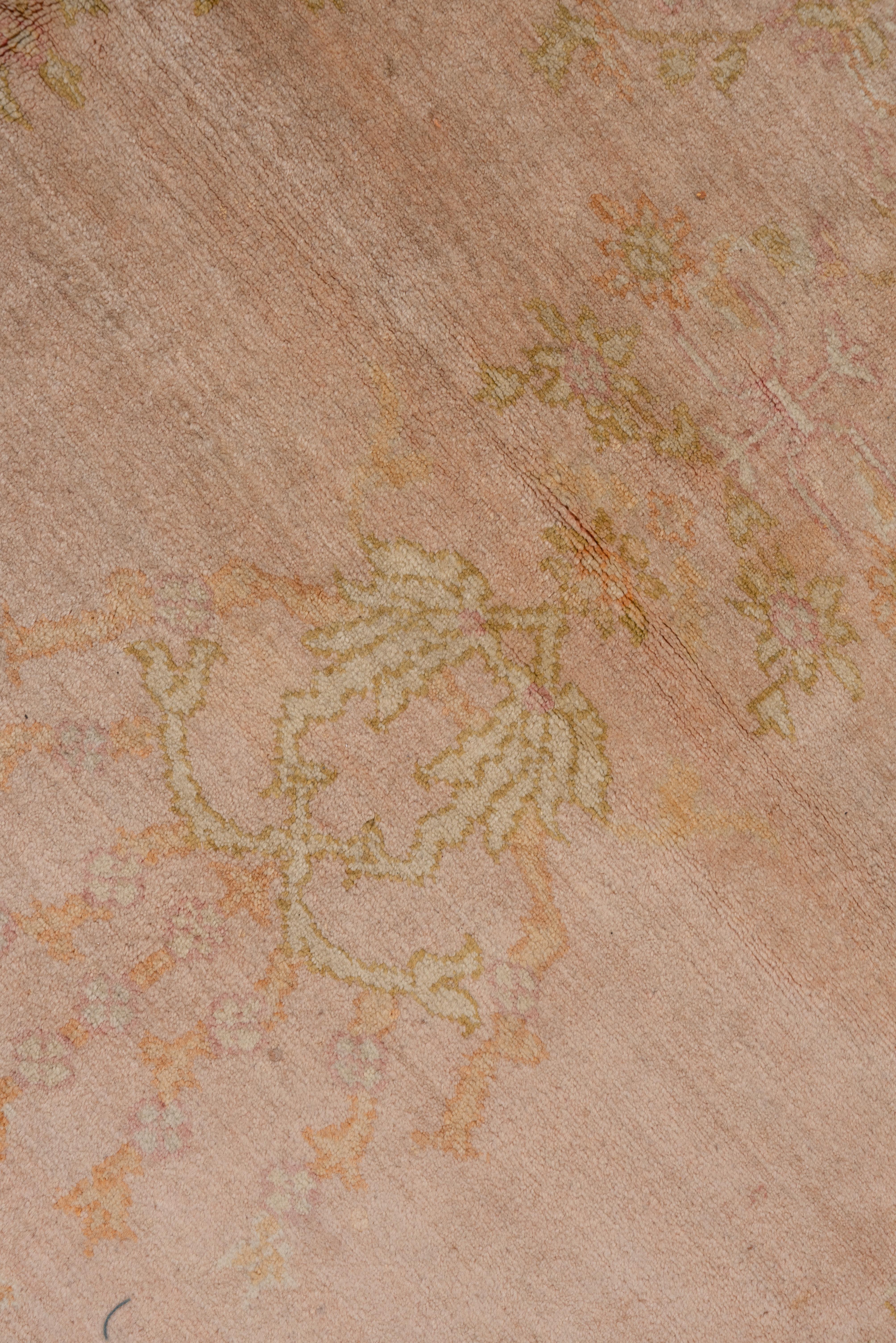 Wool 1920s Antique Pink Oushak Carpet with a Curvilinear Medallion For Sale