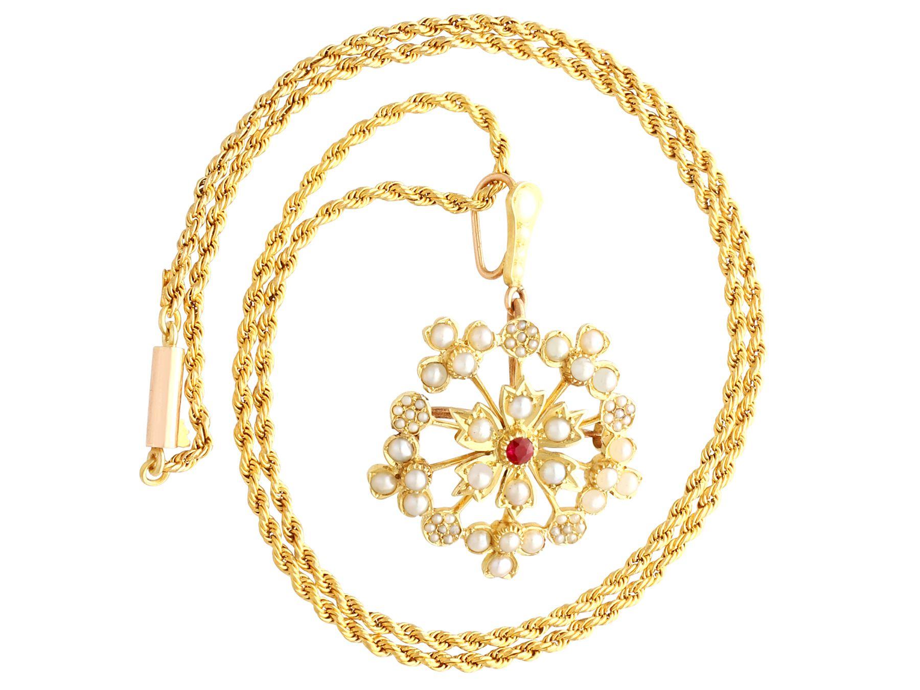 A fine and impressive antique 0.06 carat ruby and seed pearl, 15 karat yellow gold pendant/brooch; part of our antique jewelry and estate jewelry collections.

This fine and impressive antique brooch/pendant has been crafted in 15k yellow