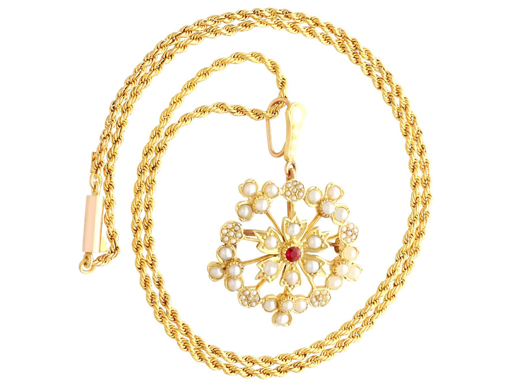 A fine and impressive antique 0.06 carat ruby and seed pearl, 15 karat yellow gold pendant/brooch; part of our antique jewelry and estate jewelry collections..

This fine and impressive antique brooch/pendant has been crafted in 15k yellow