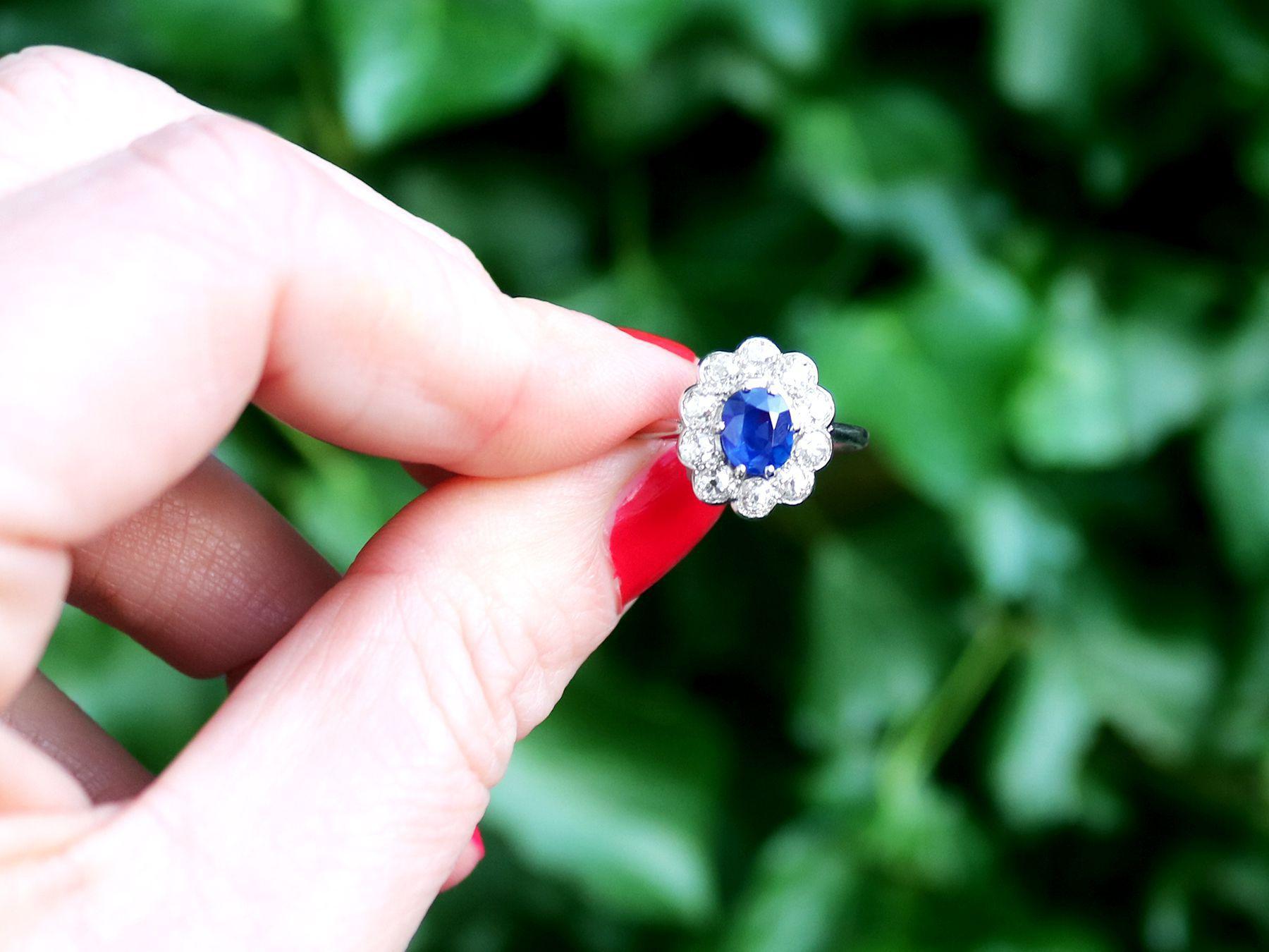 A stunning antique 1920s 0.95 carat sapphire and 1.15 carat diamond, platinum cluster style dress ring; part of our diverse antique jewelry and estate jewelry collections.

This stunning, fine and impressive sapphire ring has been crafted in