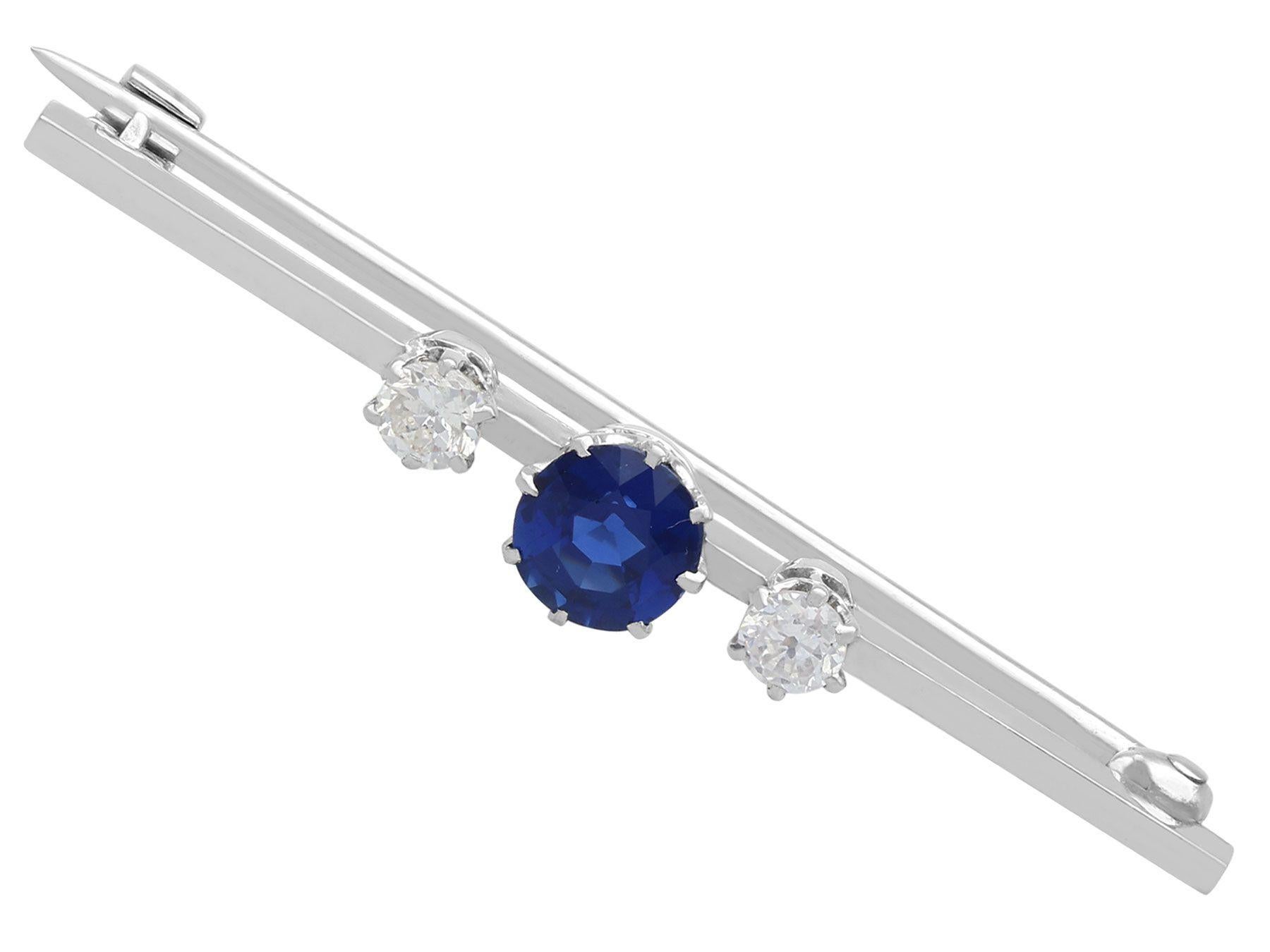 An impressive antique 1920s 0.65 carat sapphire and 0.22 carat diamond, platinum bar brooch; part of our diverse antique jewelry and estate jewelry collections.

This fine and impressive 1920s sapphire and diamond brooch has been crafted in