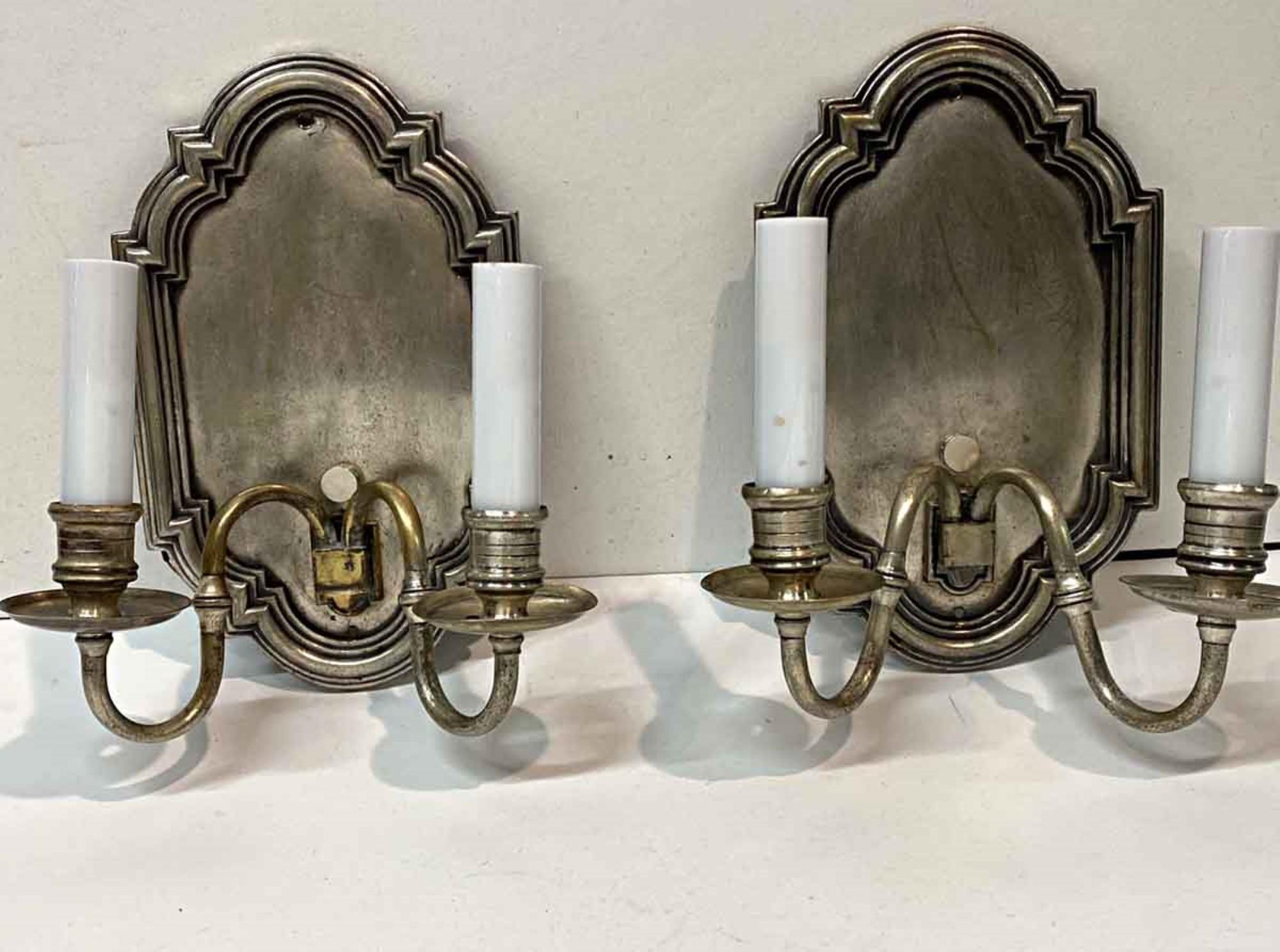 1920s pair of silver over brass double arm sconces done in a Georgian style. This can be seen at our 400 Gilligan St location in Scranton. PA.