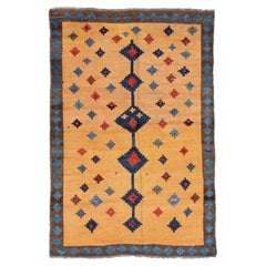 1920s Antique Tribal Gabbeh, 7'0" x 4'9" Rug with Gold and Indigo Star Motifs