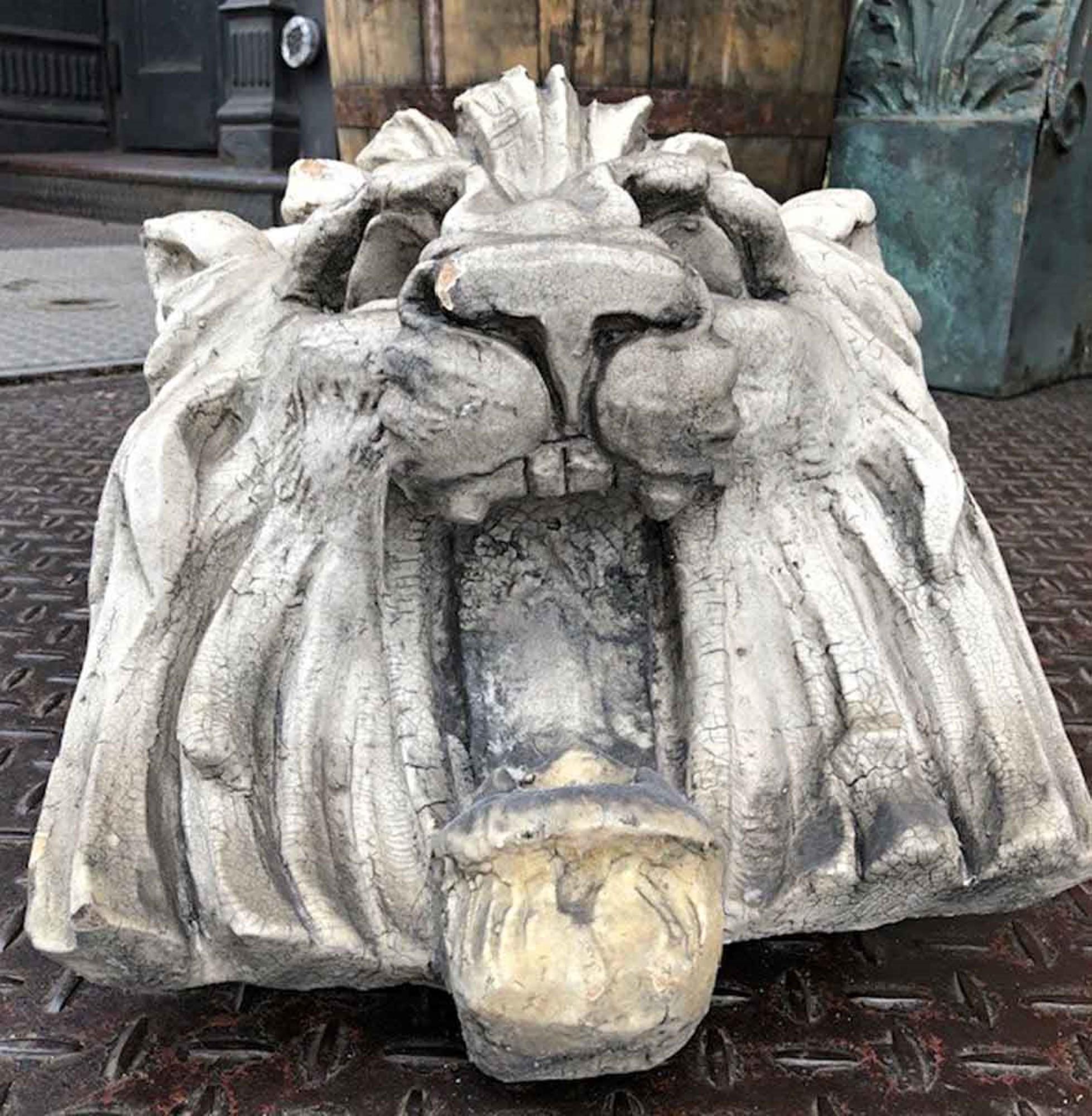 Art Deco white terra cotta lion head from the exterior of a 1920s New York City theater facade. There is amazing detail with great expression on this piece. This cat looks friendly from one angle and ferocious from another. Small quantity available