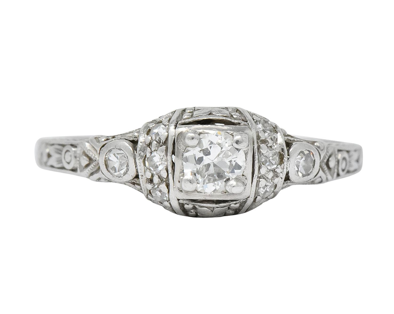 Centering a transitional cut diamond weighing approximately 0.15 carat, I/J color and SI clarity

Accented by channel set and bezel set single cut diamonds on each side, total diamond weight approximately 0.15 carat, eye-clean and white

Square form