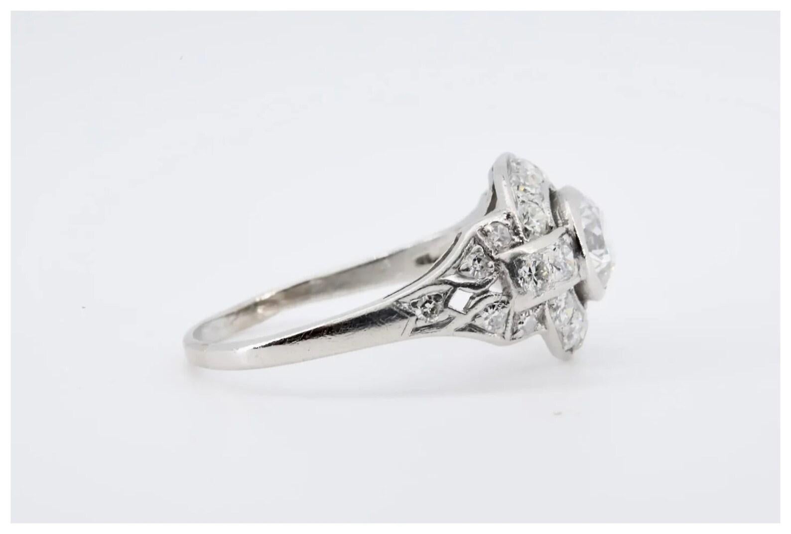 A high fashion Art Deco period old European cut diamond halo engagement ring in platinum.

Centered by a 0.75 carat old European cut diamond of G color, and SI1 clarity.

The mounting set throughout with 24 old European cut diamonds. Graded as G