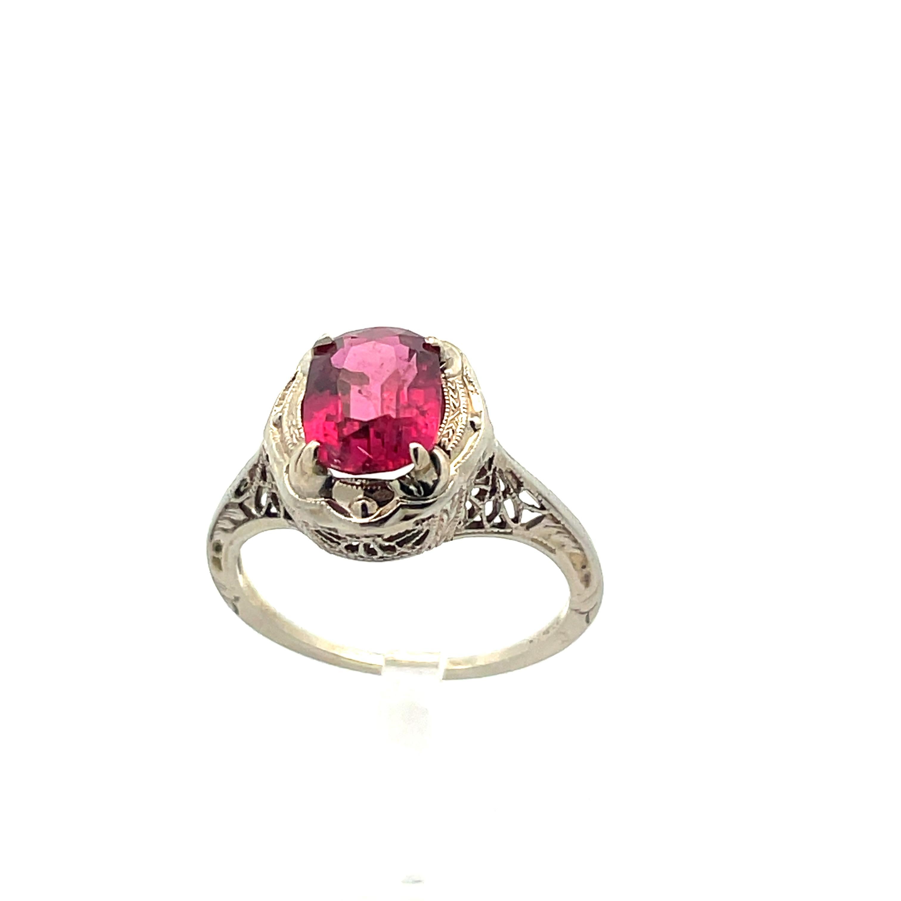 -1920s Art Deco 
- 14k White Gold Filigree 
- Red Tourmaline 
- Size 5 
- 1.97 Grams 


This beautiful 14k white gold filigree ring from the 1920s Art Deco period features a stunning red tourmaline; a gemstone admired for its beauty and symbolism.