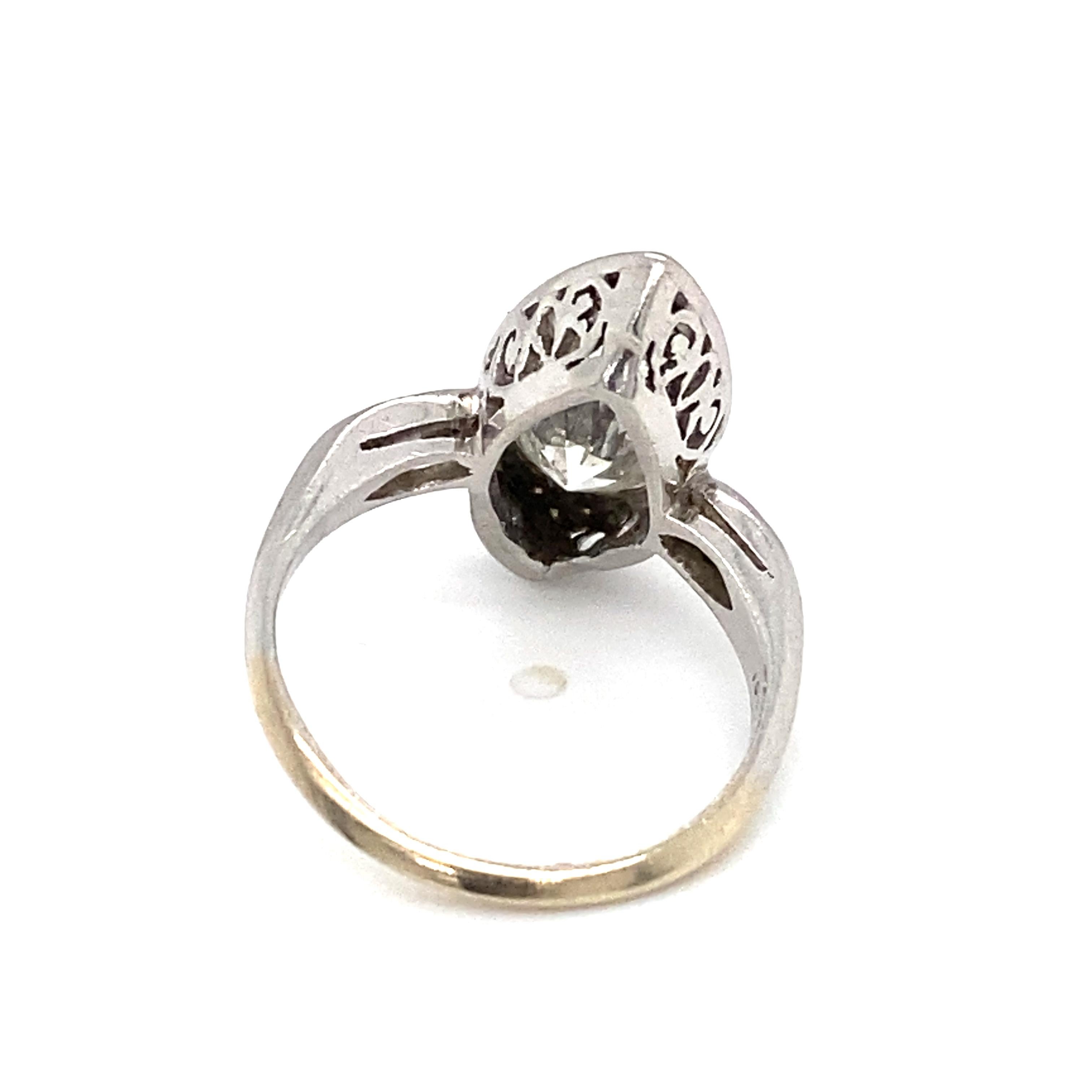 Item Details: This unique Art Deco ring features two Old European cut diamonds and additional accent stones in a navette design, popular in the 1920s and 1930s. 

Circa: 1920s
Metal Type: Platinum
Weight: 3.7g
Size: US 5, resizable

Diamond