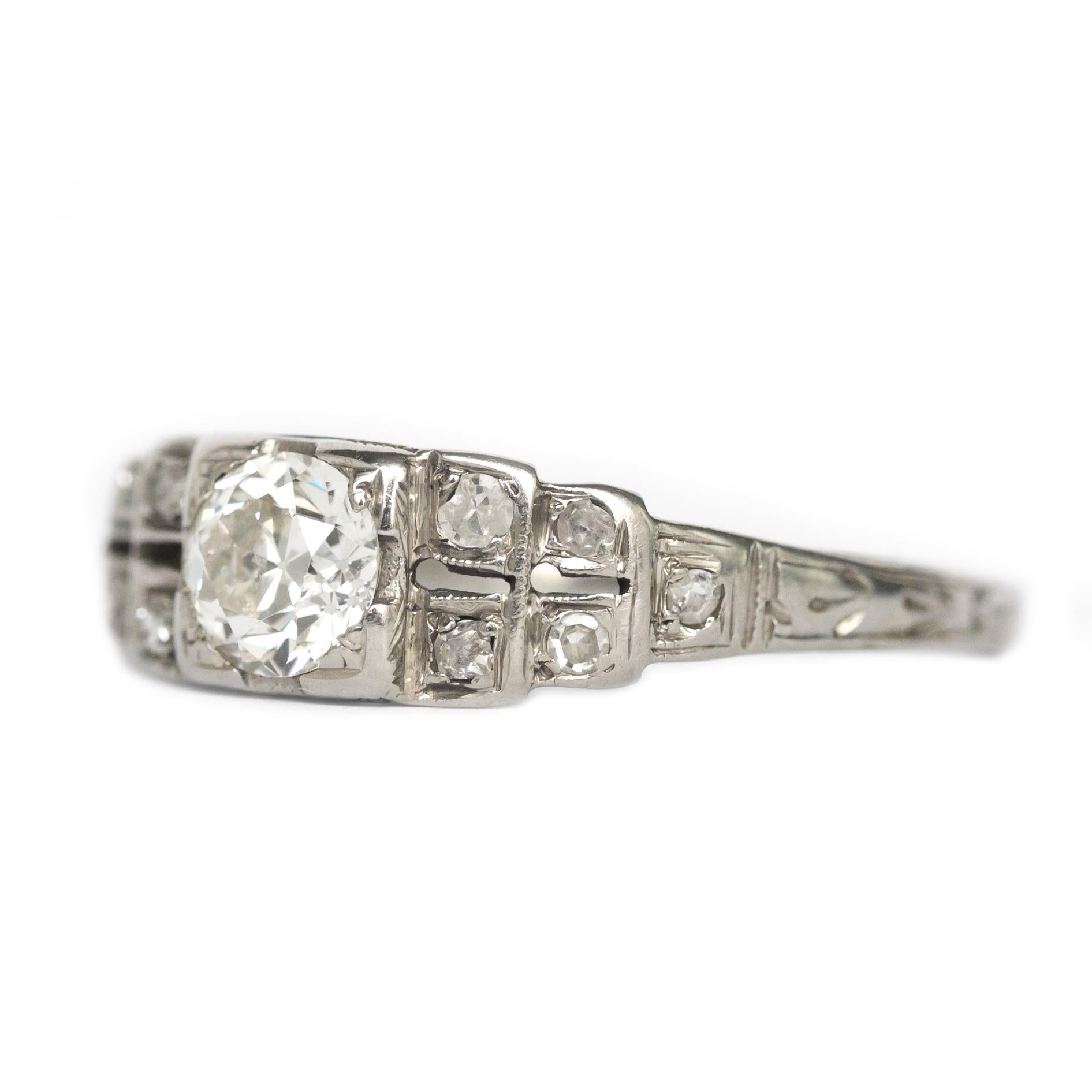 Item Details: 
Ring Size: 6.75
Metal Type: 18 Karat White Gold
Weight: 2.3 grams

Center Diamond Details:
Shape: Old European Brilliant
Carat Weight: .45 carat
Color: I
Clarity: VS1

Side Stone Details: 
Shape: Antique Single Cut
Total Carat Weight: