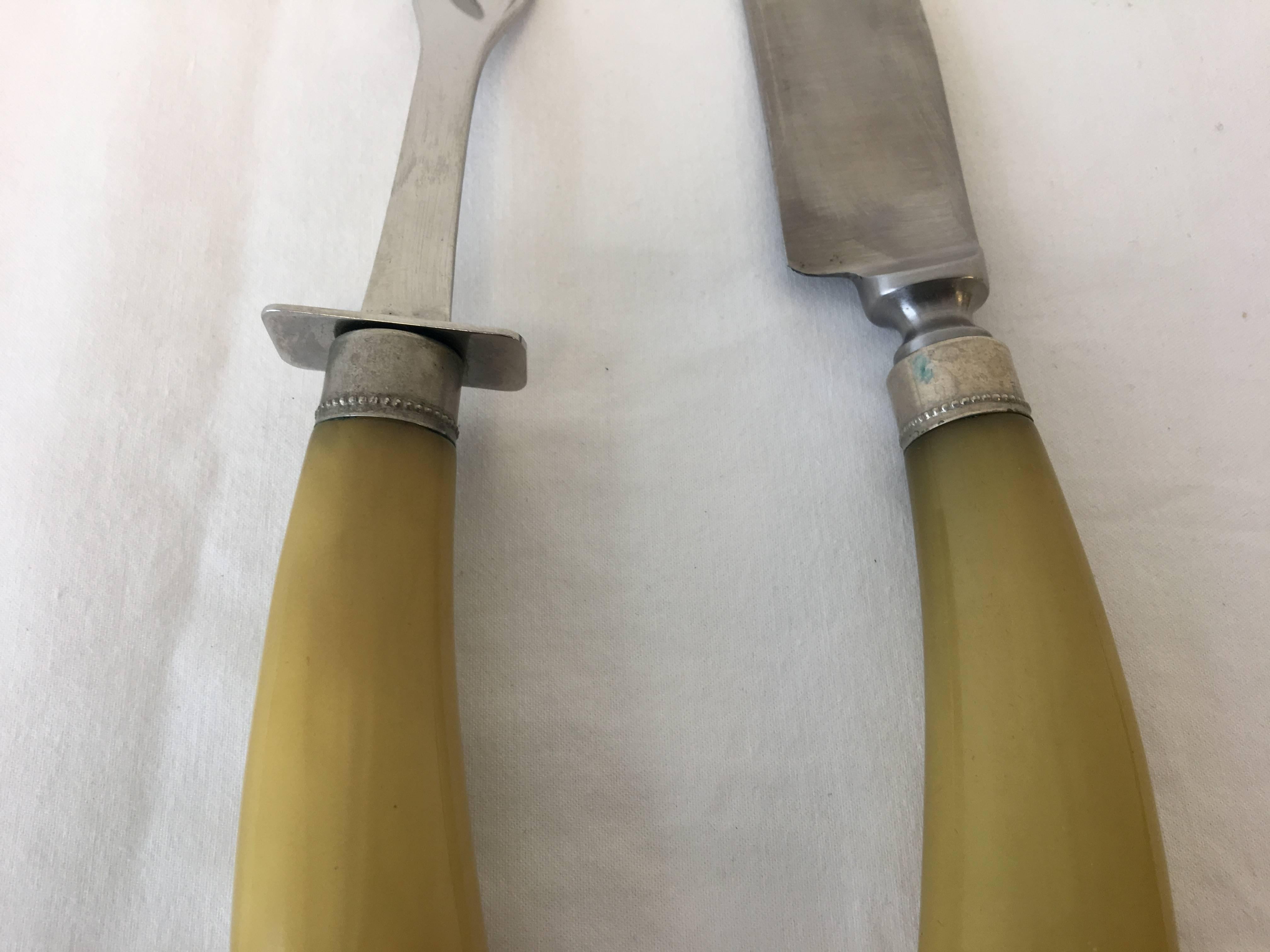 Listed are a gorgeous set of 1920s, Art Deco bakelite carving knife and fork.