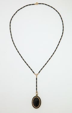 1920s Art Deco Black Enamel with Seed Pearls and Diamonds Gold Locket Necklace