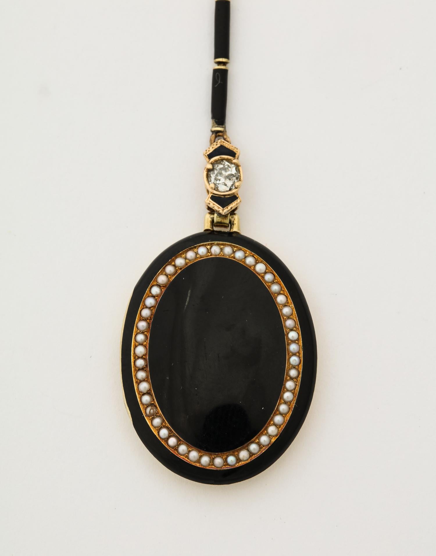 1920s Art Deco Black Enamel with Seed Pearls and Diamonds Gold Locket Necklace In Good Condition For Sale In New York, NY