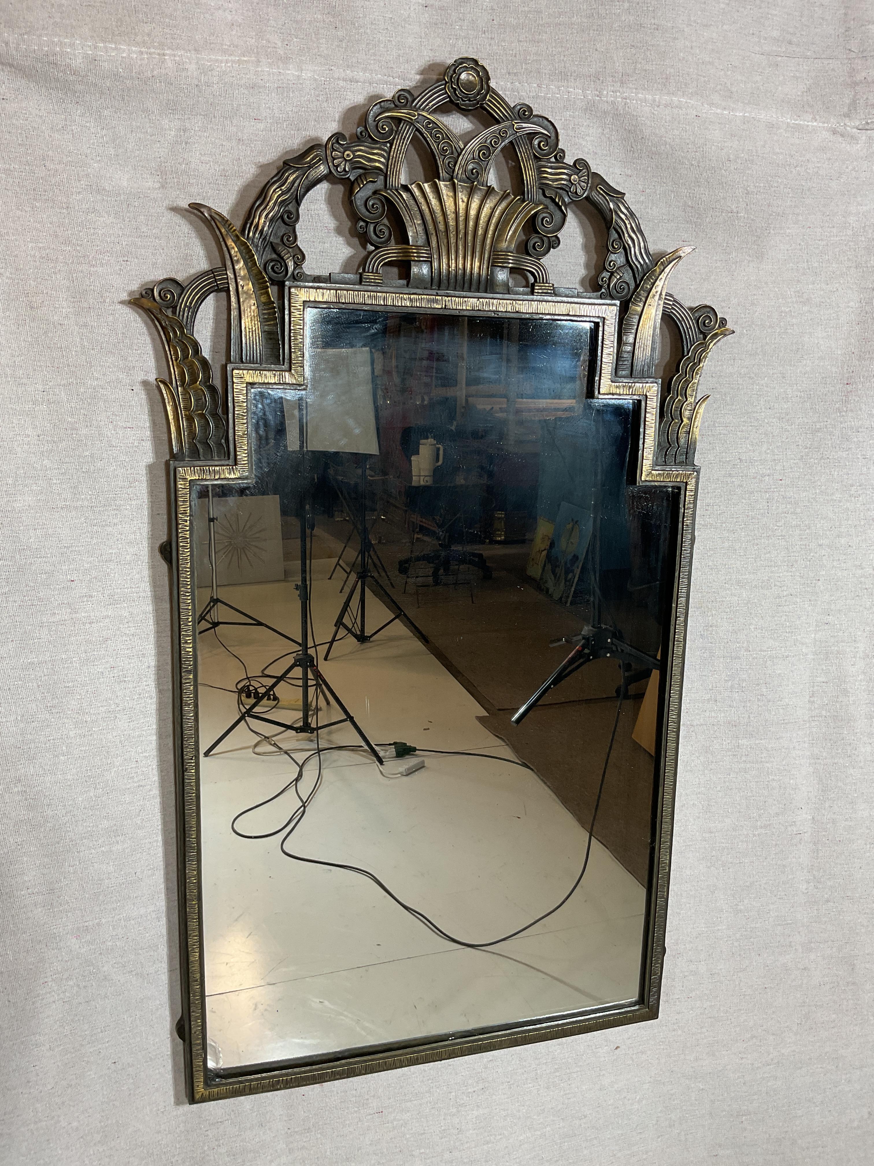 Art Deco bronze console and mirror set
Made in the 1920s by La Salle Iron Works
Made In NYC
Marked on the inside of the console

A beautiful example of high style Art Deco design

Mirror dimensions:
Width: 19.5 inches
Height: 33.5 inches
Depth: .5