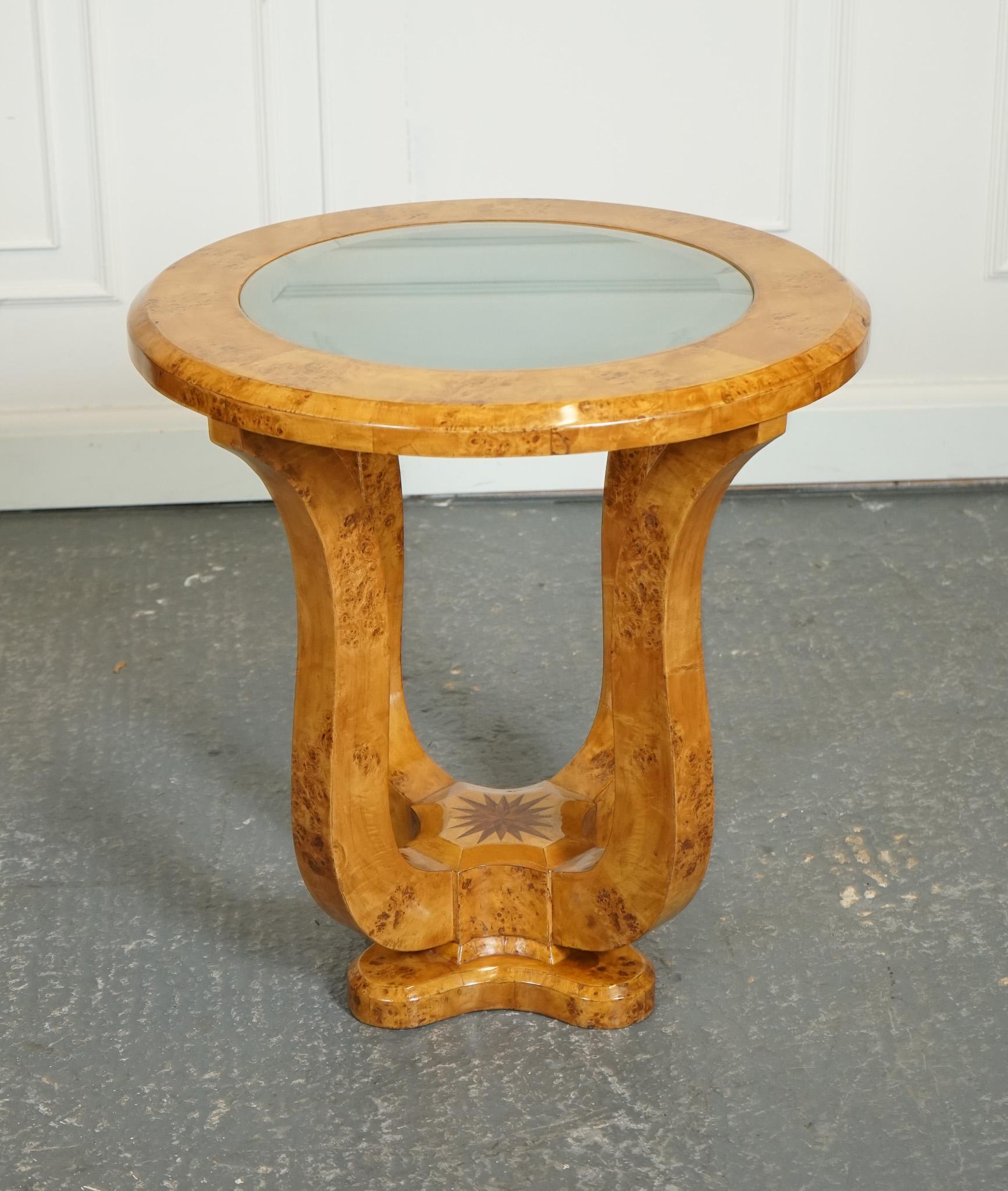 We are delighted to offer for sale this Art Deco style Burr Walnut Console Table.

The Art Deco Burr Walnut Veener on Hardwood Circular Pedestal Round Console Center Table is a striking piece of furniture that showcases the elegance and style of the