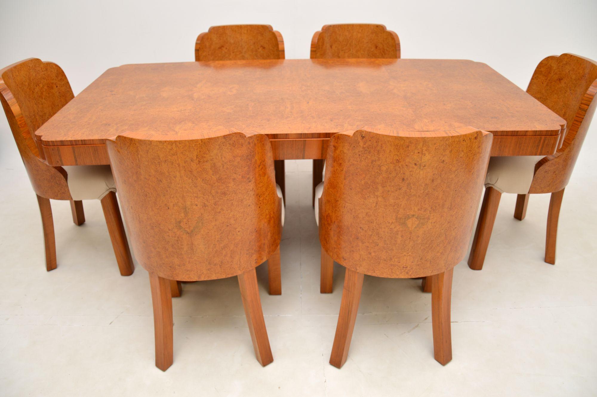 An absolutely stunning original Art Deco period cloud back dining suite in burr walnut. This was made in England, it dates from the 1920-30s.

The quality is outstanding, this is so well made and beautifully designed. The chairs have wonderful