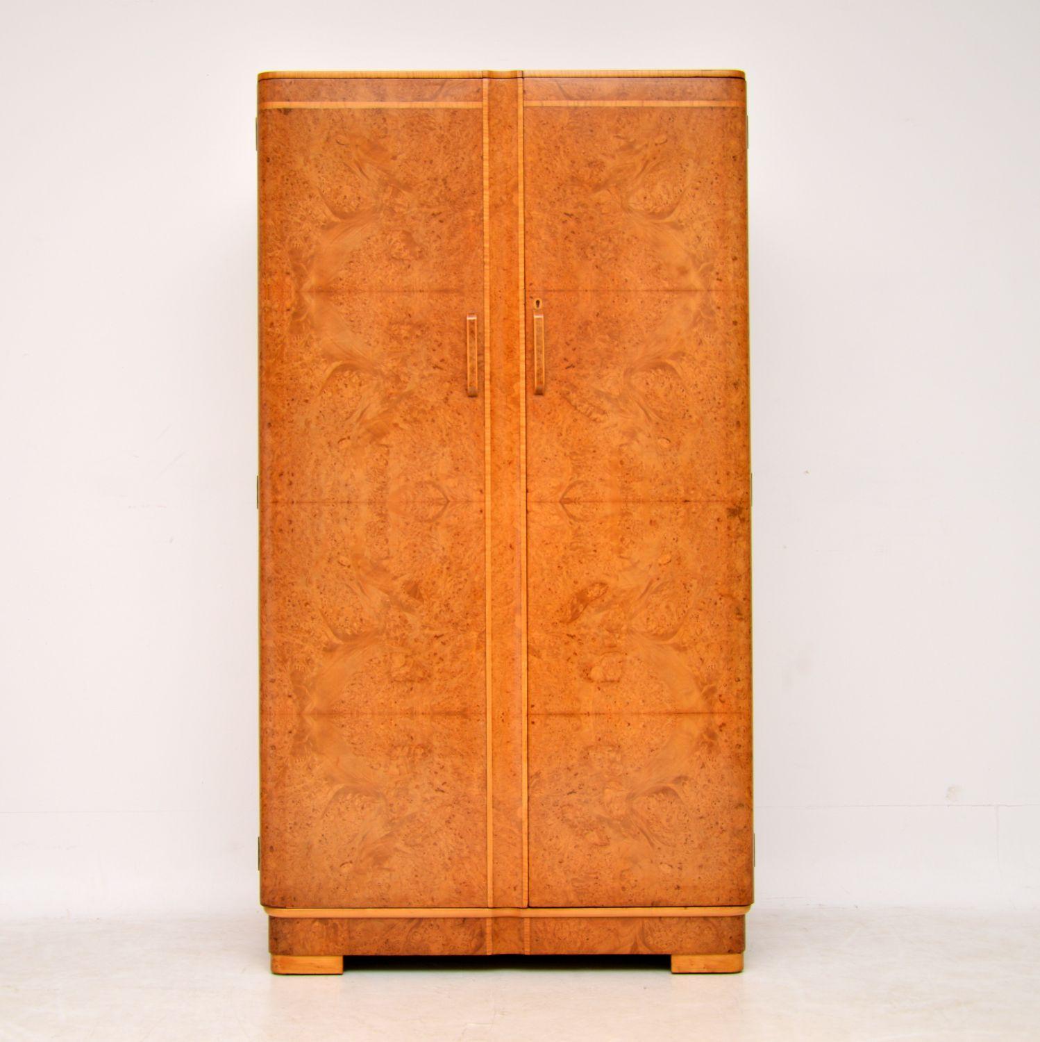 A beautiful original Art Deco period compactum wardrobe, dating from the 1920s-1930s. It’s made from burr walnut, inlaid with satin wood. We have had this stripped and re-polished to a very high standard, the condition is superb throughout. This has