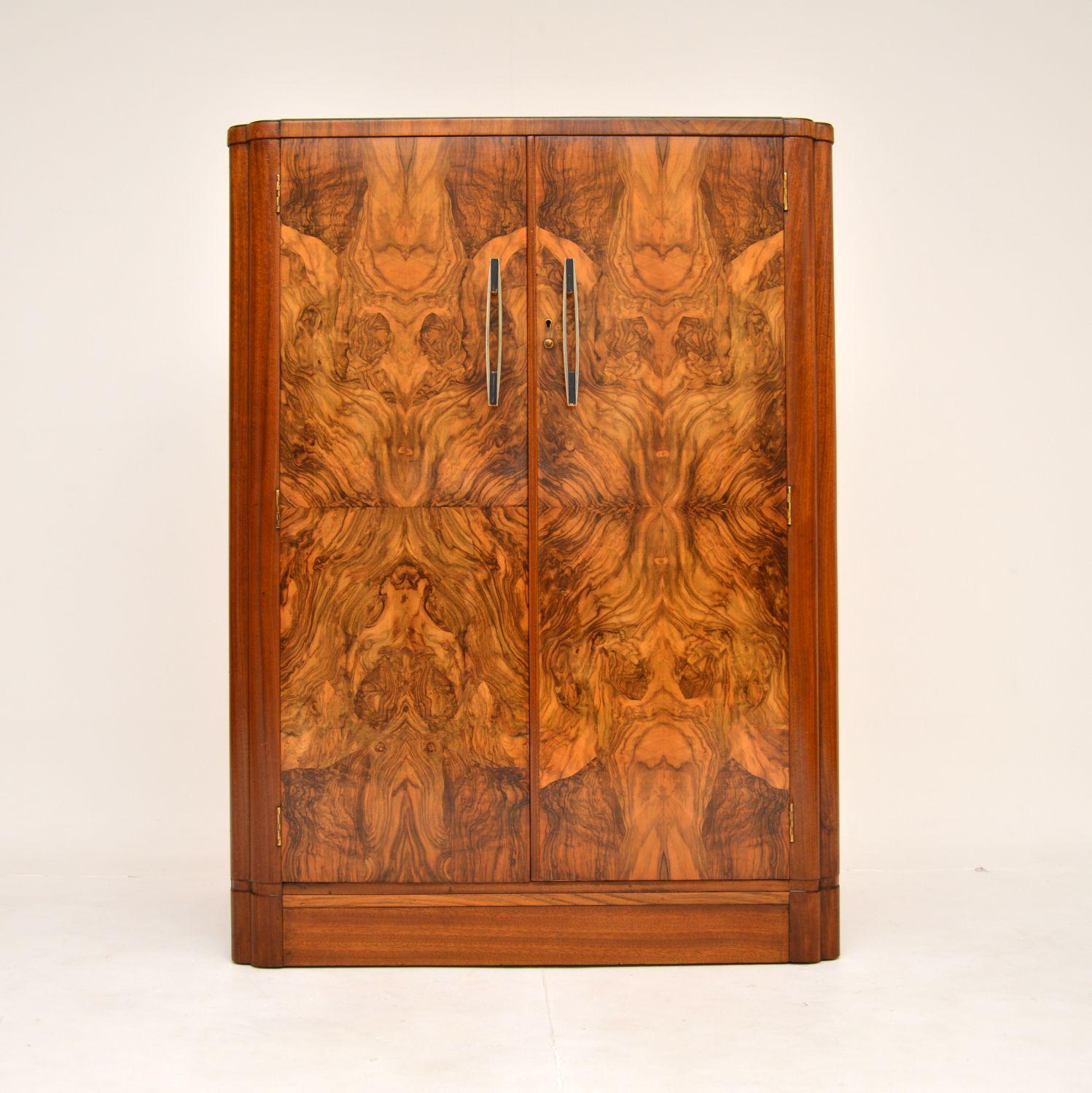 A stunning original Art Deco period compactum wardrobe in walnut. This was made in England, it dates from the 1920-30’s.

This is of amazing quality, with absolutely amazing burr walnut grain patterns on the doors and top. It has lovely rounded