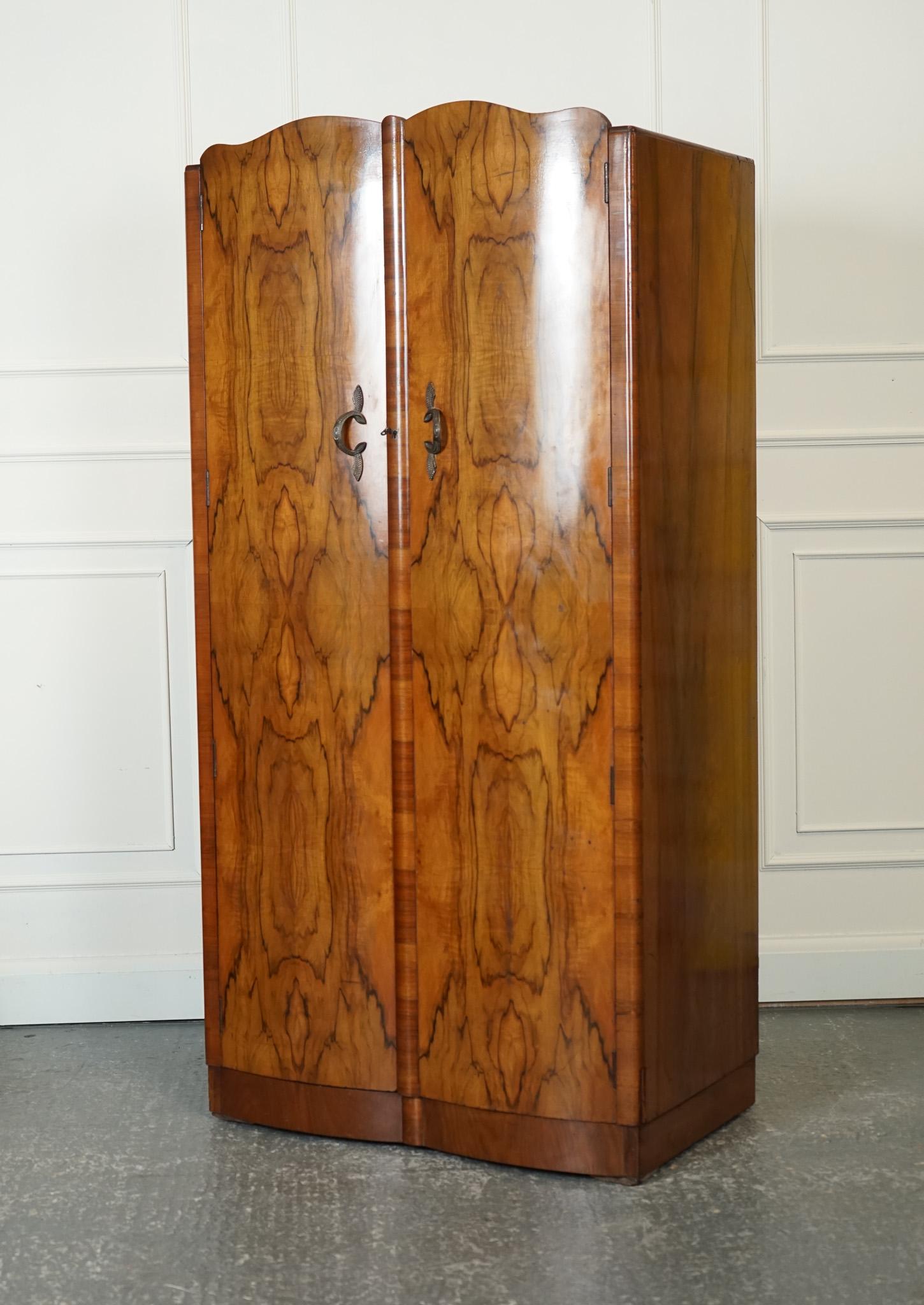Antiques of London



We are delighted to offer for sale this 1920s Large Art Deco Burr Walnut Double Wardrobe.

A stunning example of 1920's Art Deco design, this large burr walnut double wardrobe exudes elegance and sophistication. The use of