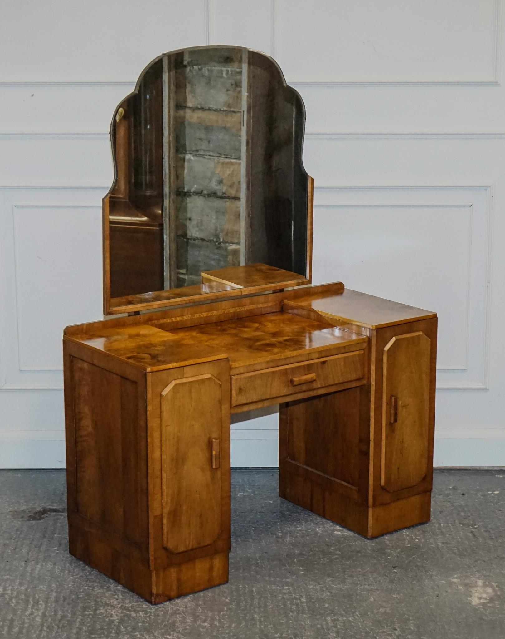
We are delighted to offer for sale this 1920s Burr Walnut Dressing Table With Large Mirror.

A beautiful well made and solid table, with some wear and one repair on the front left bottom of the desk, this will be seen on the picture.

Please