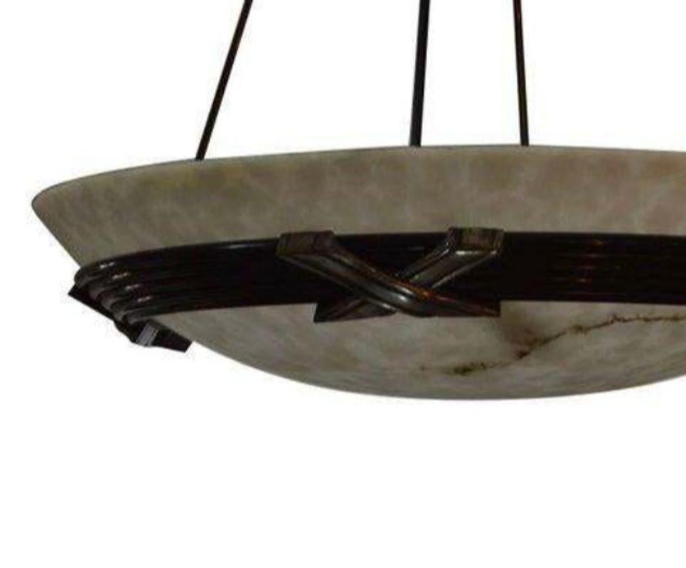 Art deco alabaster chandelier with bronze and silver finish metal. Includes four regular size light bulb.
Dimensions:
49