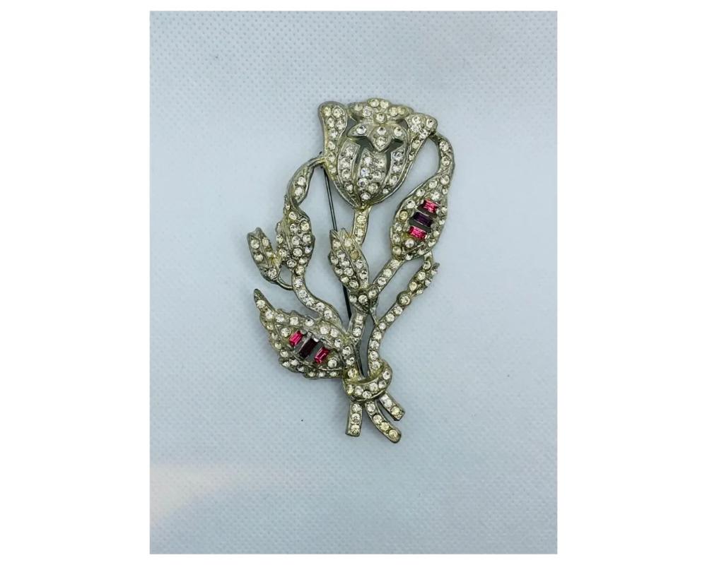1920's Art Deco Costume Jewelry Rhinestone Rose Brooch

This is a perfect example of high quality deco costume jewelry this is a very large brooch 
With red and white rhinestones all in great condition 
in good condition consistent with age please