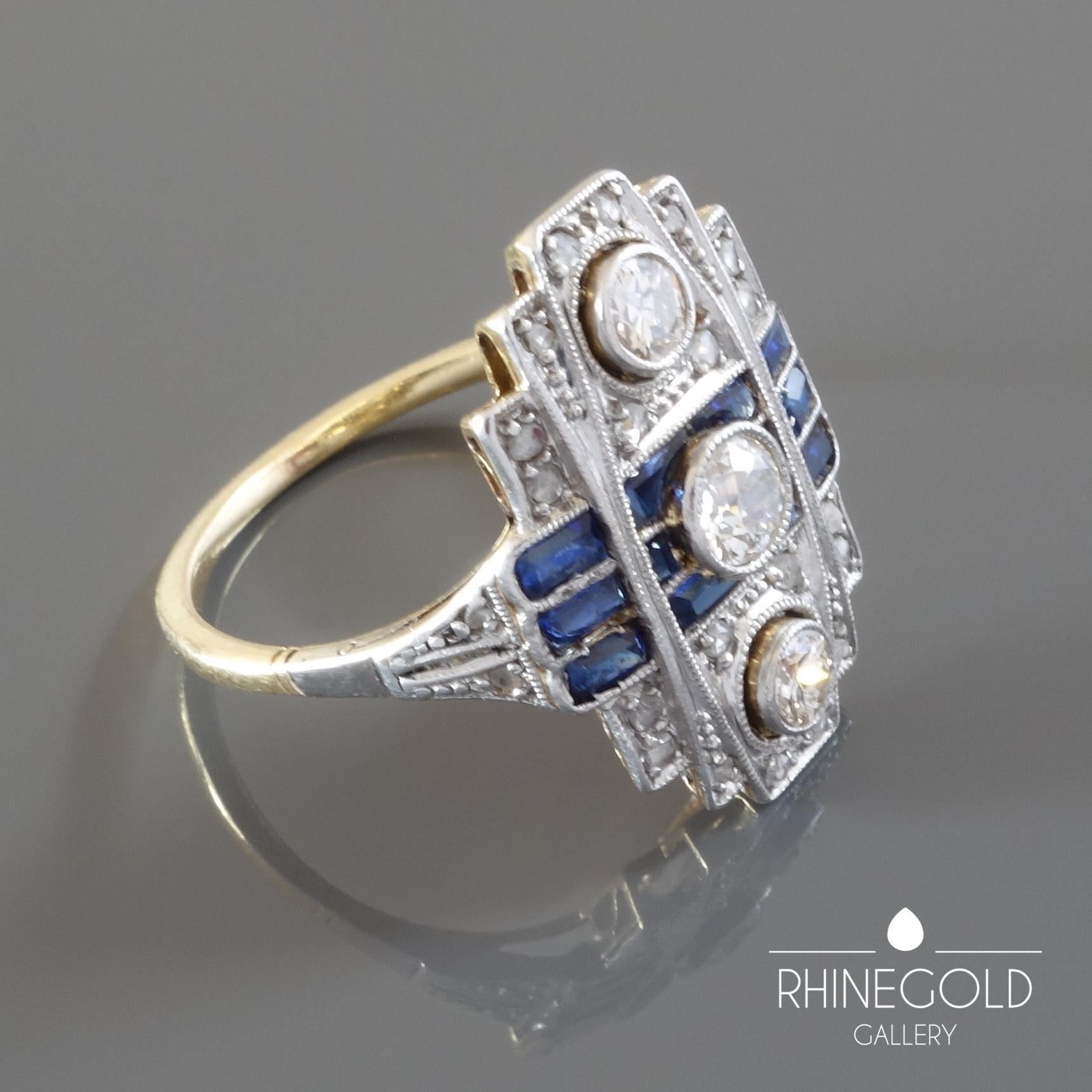 Original Art Deco Diamond Blue Sapphire White Yellow Gold Cocktail Ring
18k white and yellow gold, three old mine cut diamonds of approx. 0.2 + 0.1 + 0.1 carat (J; vvs2-vs1) , numerous small rose cut diamonds, blue sapphires of approx. 0.5 carat in