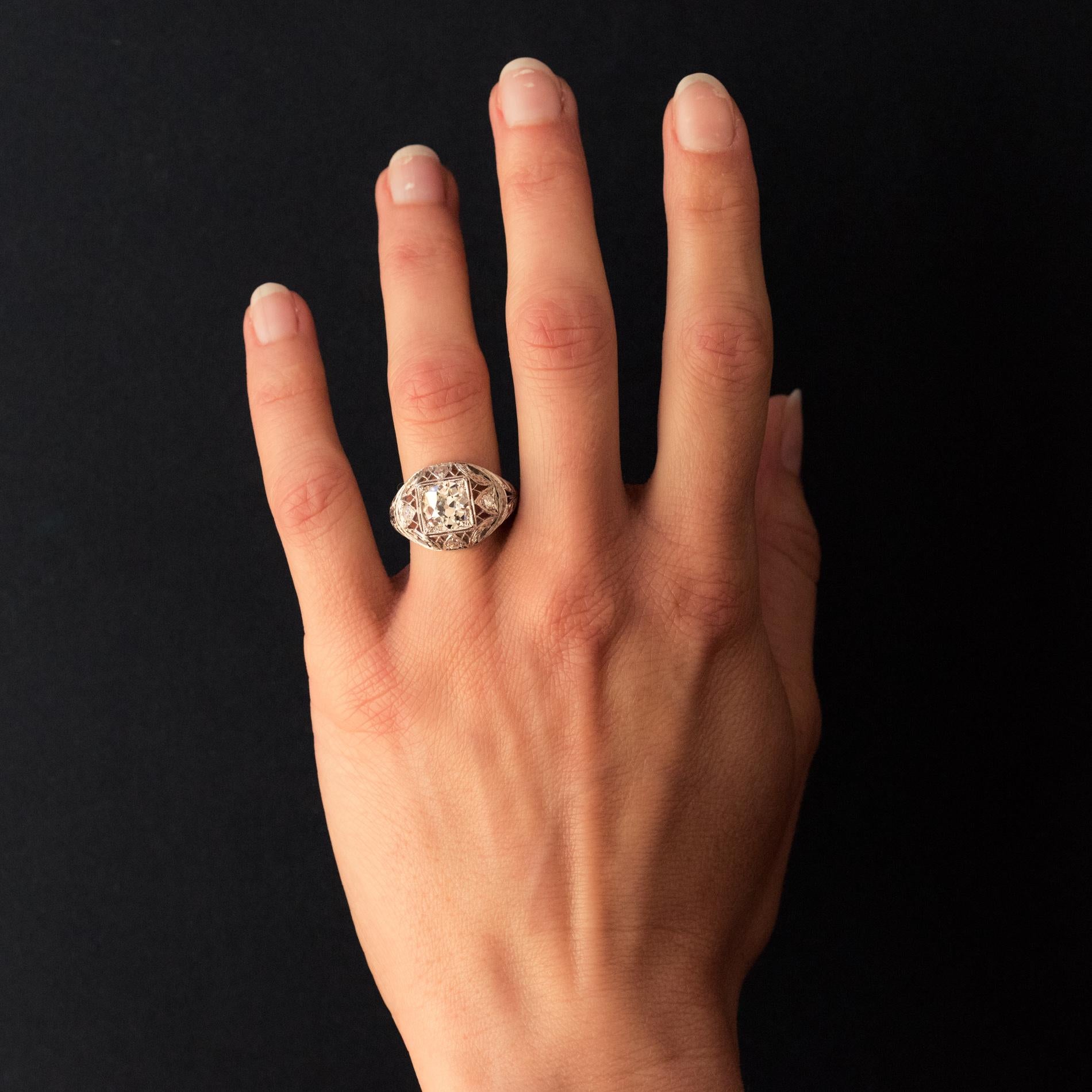 Ring in platinum.
Sublime antique dome-shaped ring, it is set on its top with a geometric decoration of an antique brilliant-cut diamond. The entire mounting is delicately engraved, perforated and set with 4 diamonds with 4 cardinal points.
Main