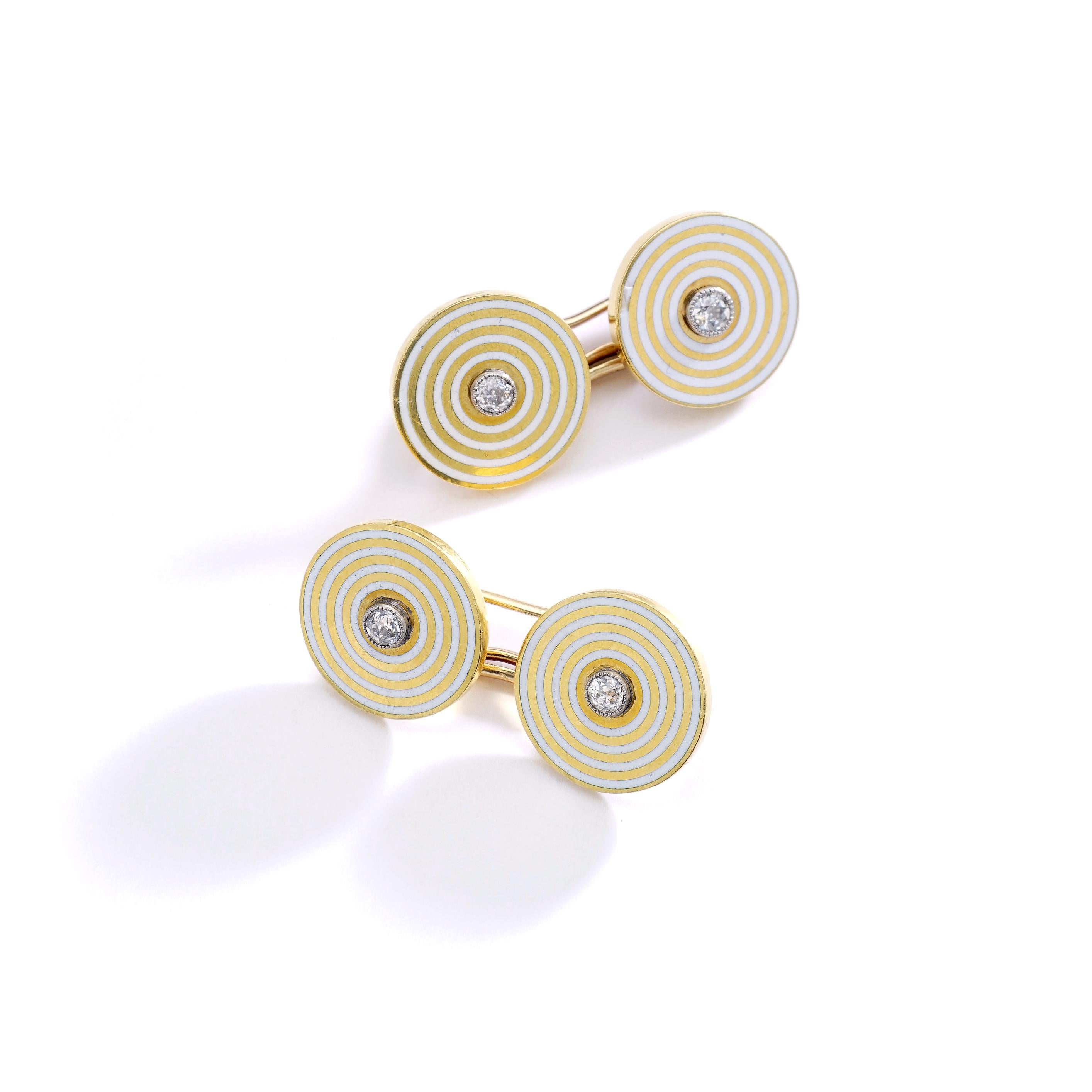 Typical patterns from the Art Deco period, a pair of yellow gold 18k 750 cufflinks, white circles enameled, each one is centered by a small diamond close set on platinum. 
Circa 1920. 

Original case Charles Fontana.
Gross weight: 12.07 grams.