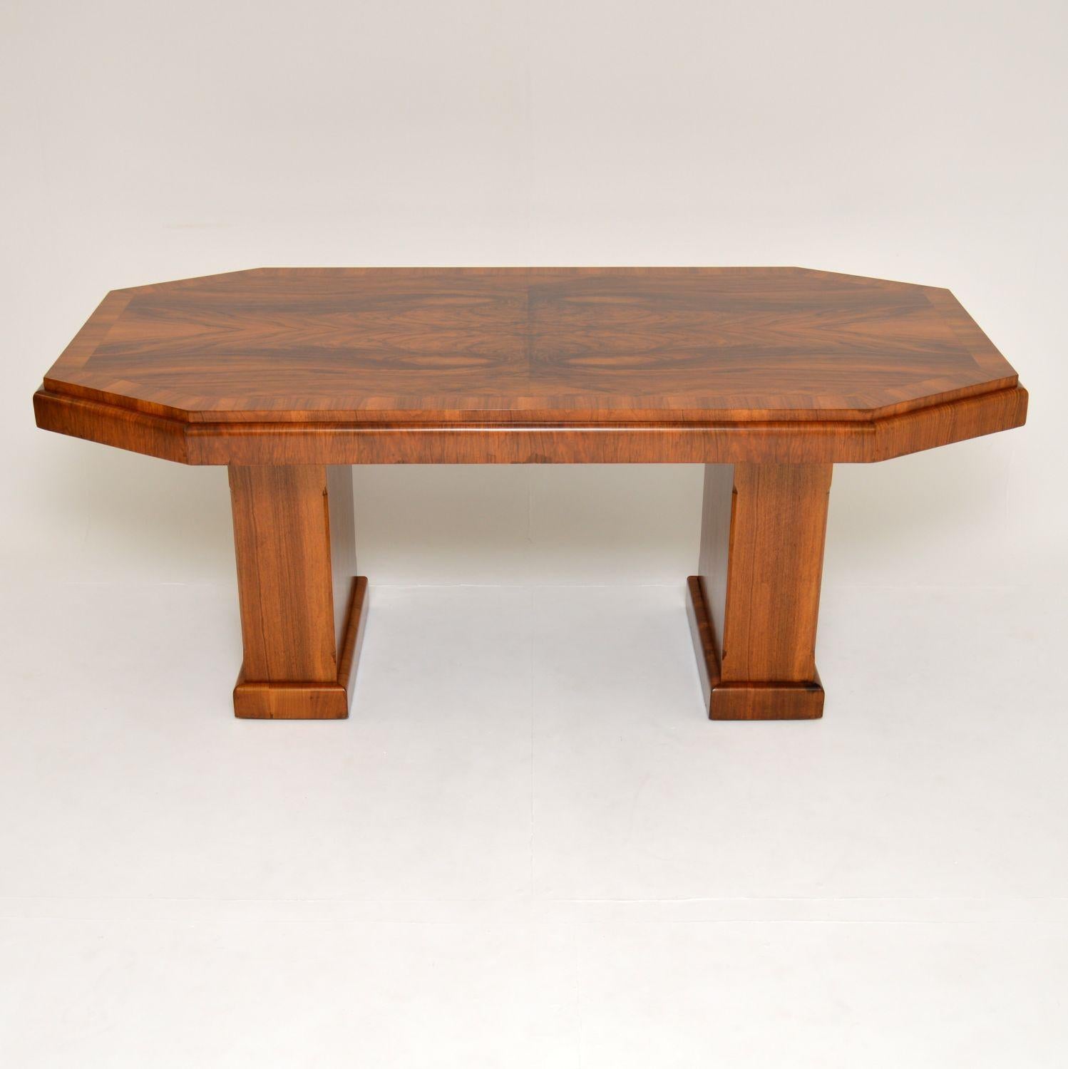 A stunning original Art Deco period dining table in walnut. This was made in England, it dates from the 1920s-1930s.

It is of amazing quality, with thick edges and two fantastic pedestal bases. The bases detach and this comes apart in three