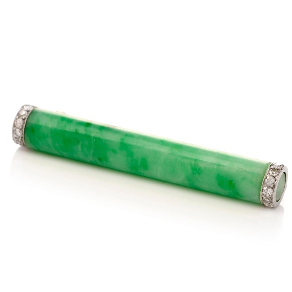 This stunning antique Art Deco Natural jade and diamond bar brooch pin is crafted with solid platinum, weighing 9.3 grams and measuring 48mm long x 7mm wide. Composed of one GIA Certified  natural jade  without any treatments capped with 12 round
