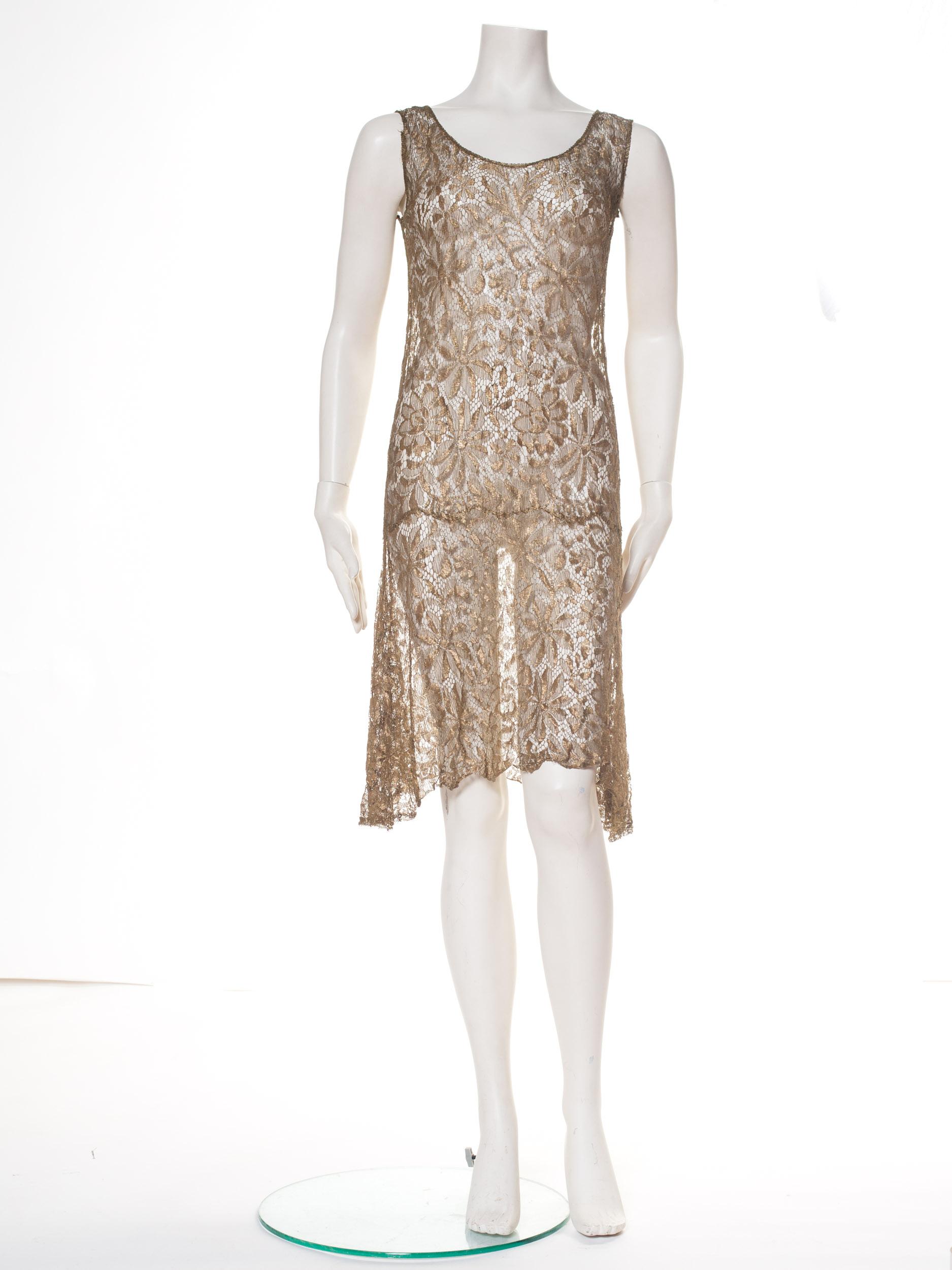 Beautiful golden metal lamé lace dress from the 1920s, picked up in Paris and ready to travel the world of parties. 
