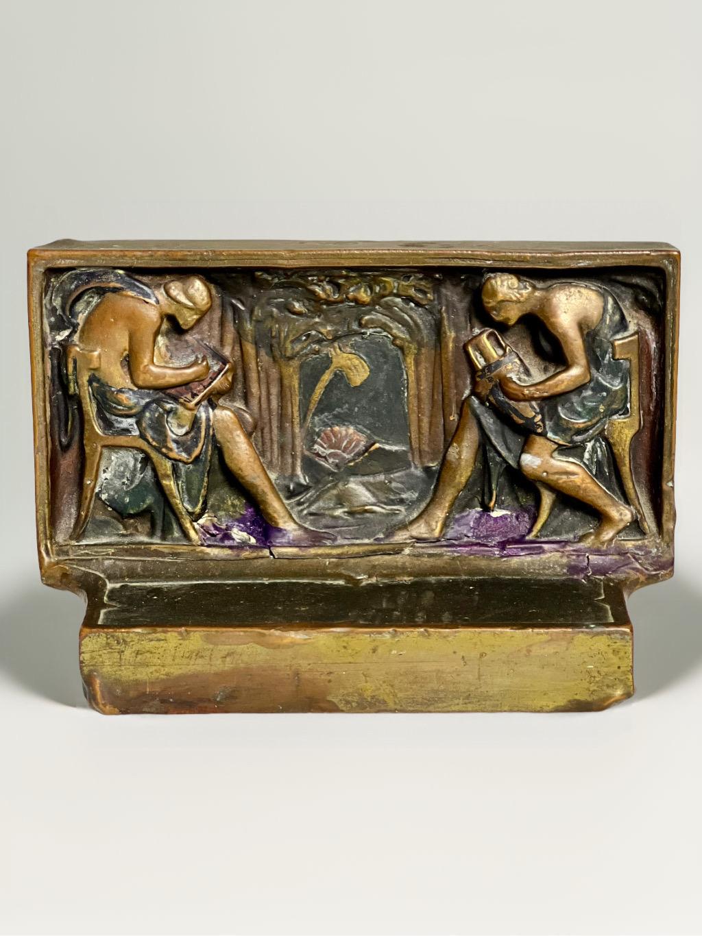 Coppia di intriganti fermalibri in bronzo di epoca Art Déco intitolati 