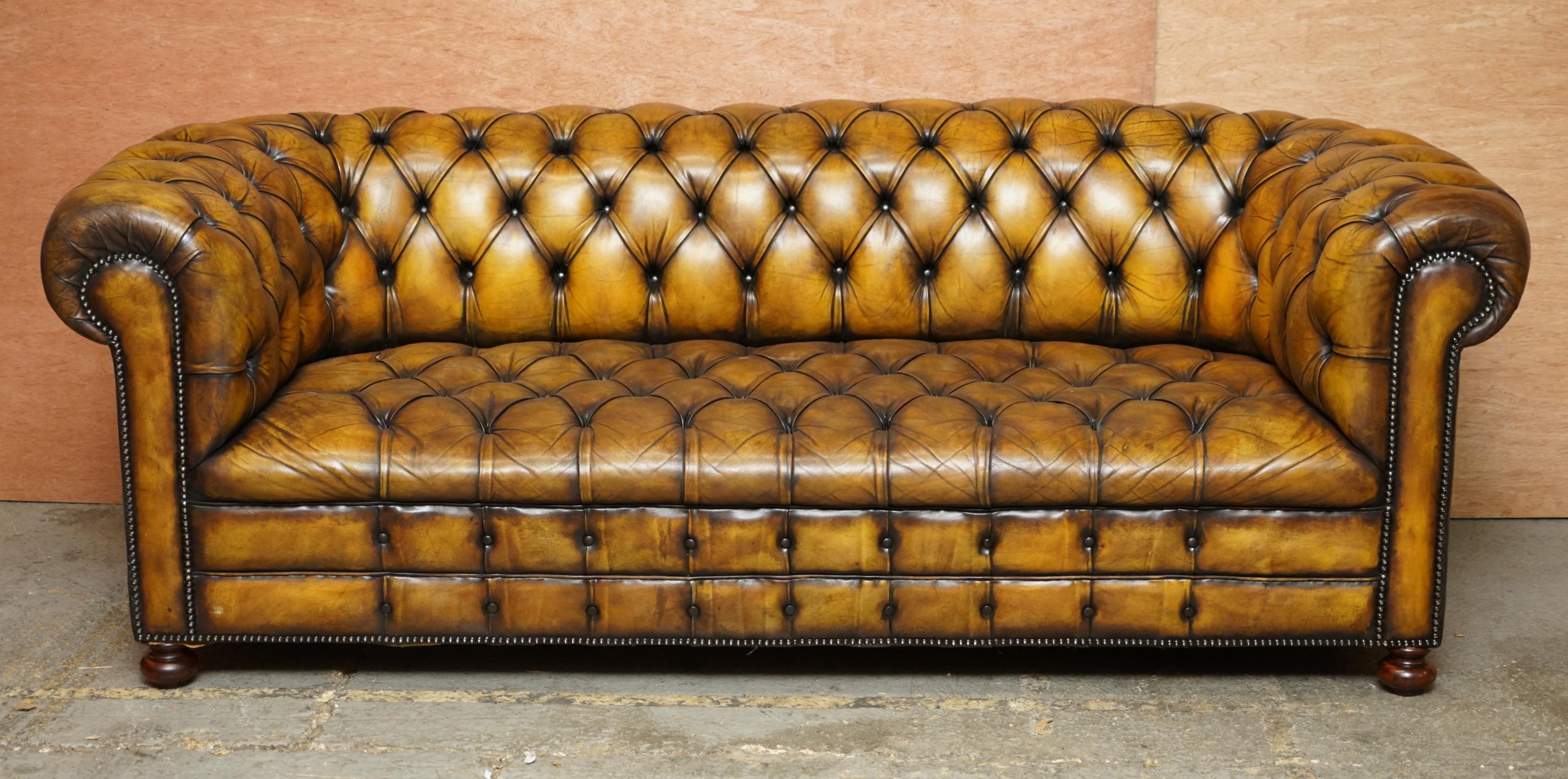 We are delighted to offer for sale this original Art Deco circa 1920's Whisky brown leather Chesterfield club sofa in restored condition with fully buttoned base 

This is a very good find, you almost never come across early 20th century