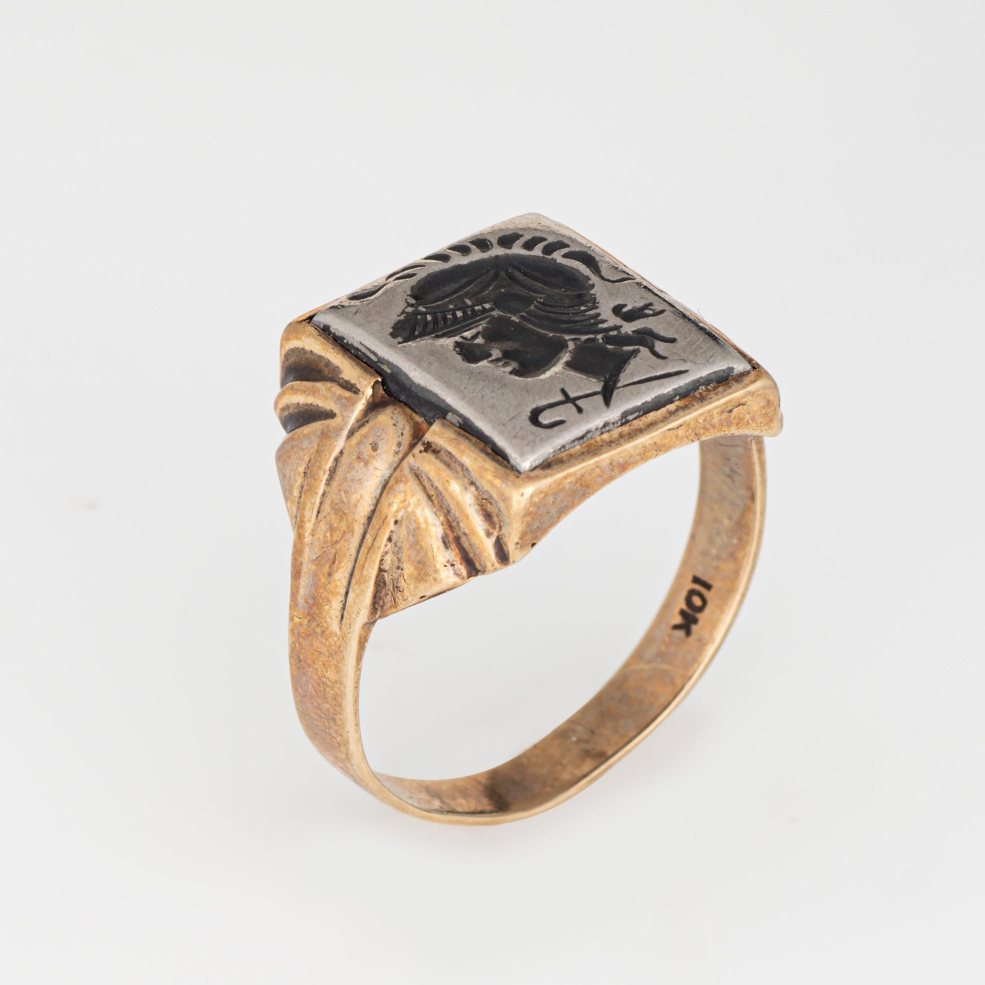 Finely detailed vintage Art Deco hematite intaglio ring (circa 1920s to 1930s) crafted in 10 karat yellow gold. 

Hematite measures 12mm x 10mm.

The striking Art Deco era ring features an intaglio depicting the bust of a Roman soldier. The side