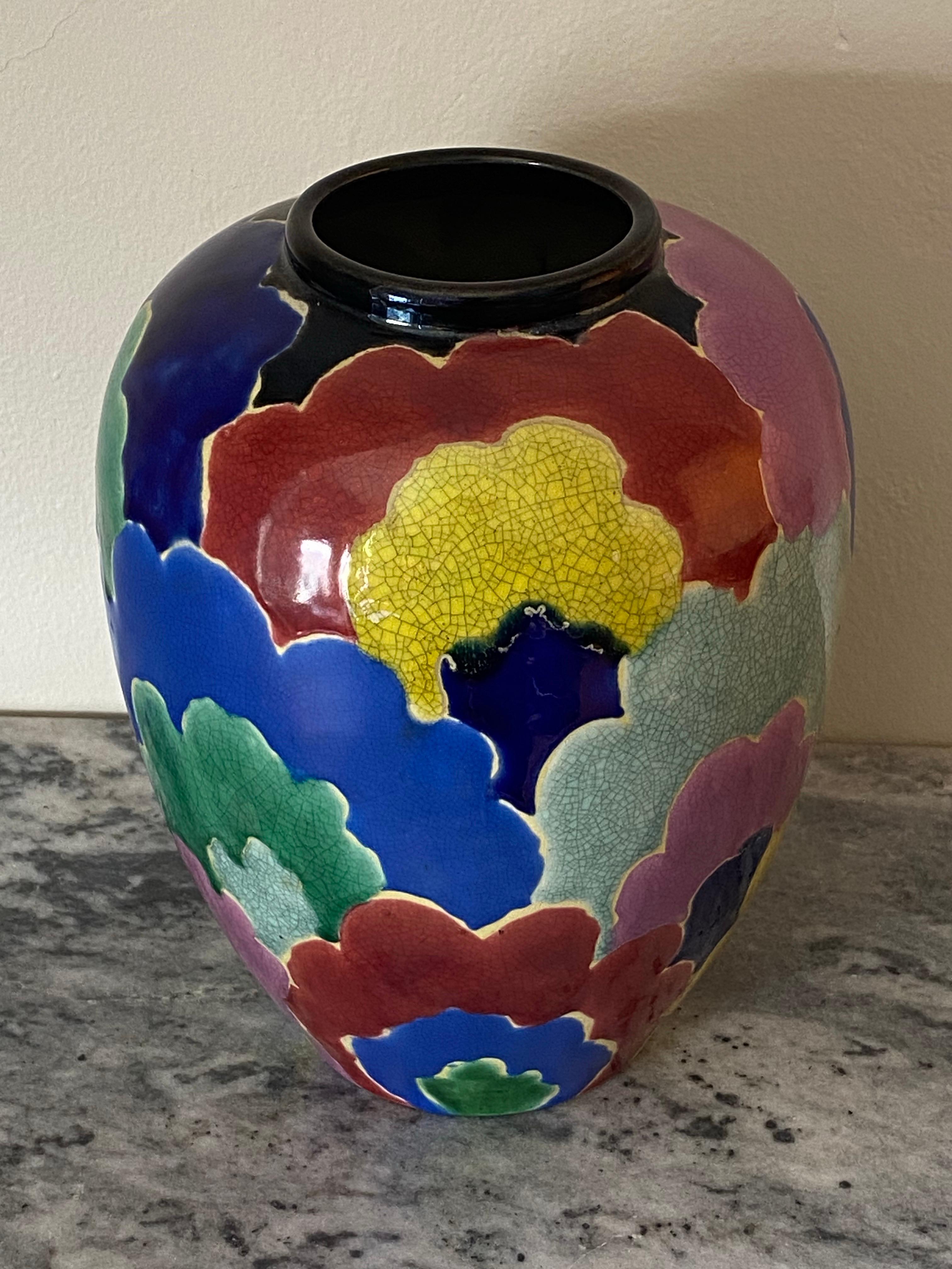 An exceptional c1920 rainbow-colored Art Deco Awaji Pottery vase with an overlapping cloud-like motif. Multicolored pieces of Awaji Pottery all too often suffer from glazes migrating into other colors. Fortunately and most unusual is the lack of