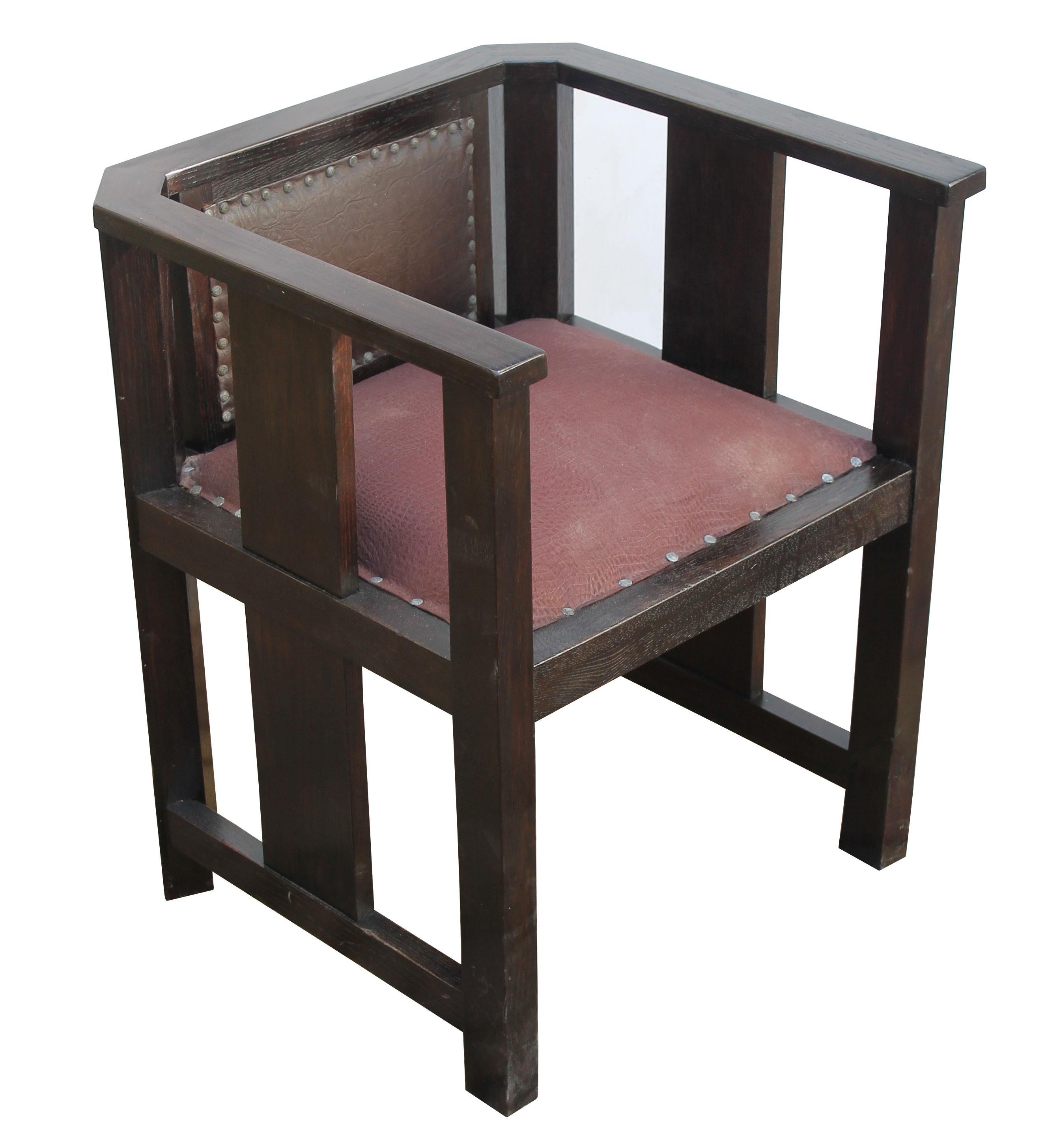 This is an original lounge chair believed to be produced in the 1920s and designed in the Art Deco style. The compact design and decor of this chair is somehow similar to the work of artists and architects of the Wiener Werkstätte group at the