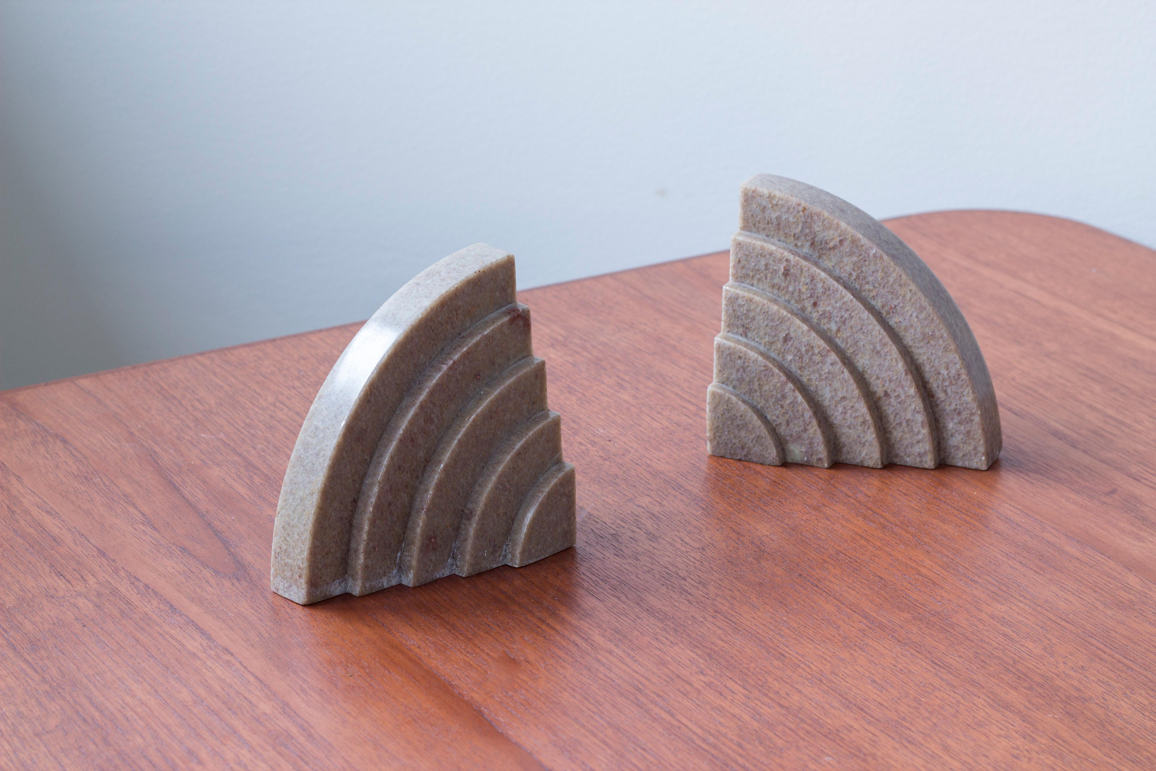 Geometrical Art deco bookends made from marble stone in a light pink color. Made in Sweden during the 1920s. Typical geometrical aesthetic for the Art deco era. Good vintage condition with age related wear and patina. Small flea bite to the lower