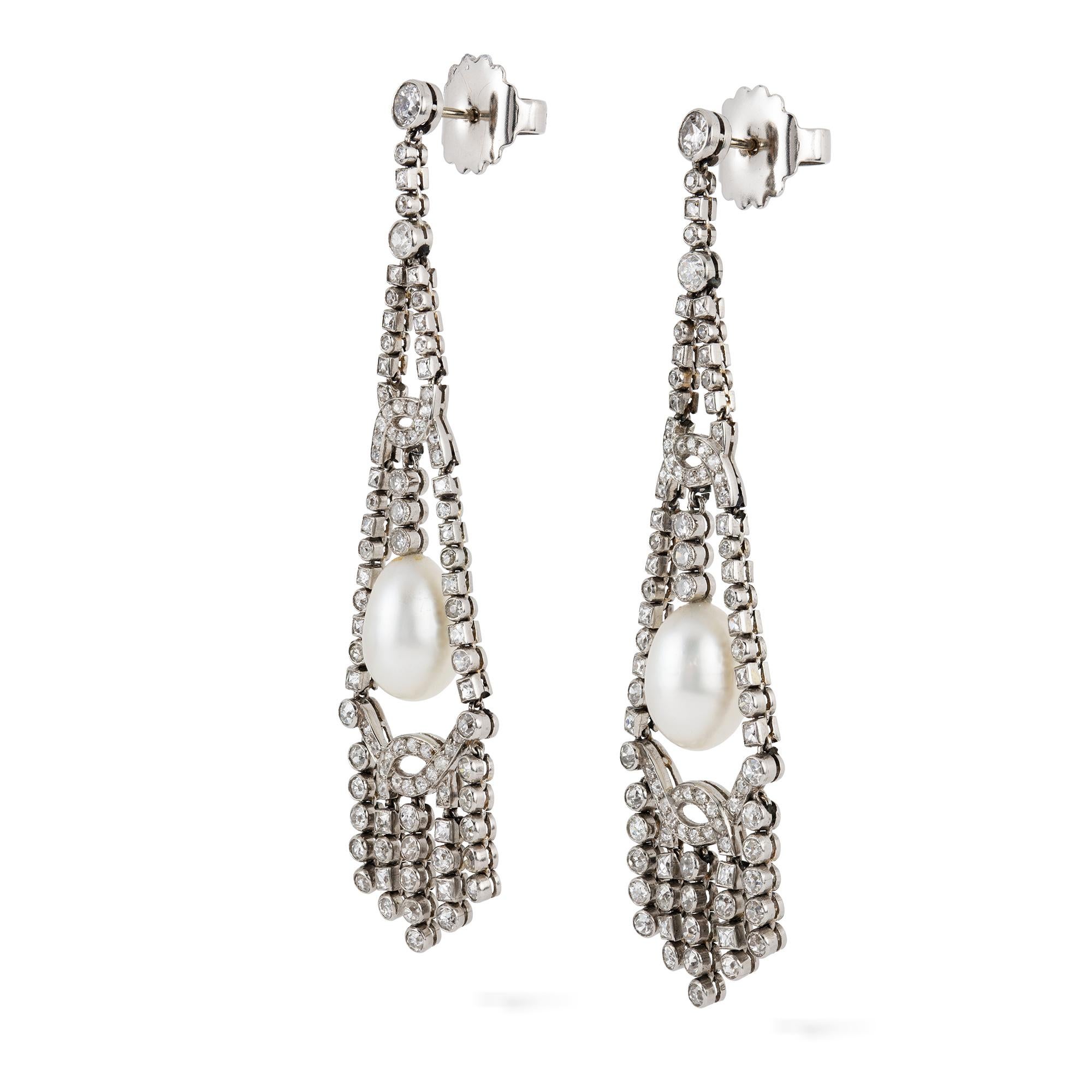An important pair of Art Deco pearl and diamond fringe drop earrings, the two natural saltwater pearls measuring approximately 8 x 12mm and weighing a total of 10.04 carats, accompanied by Gem & Pearl Laboratory certificate, each suspended within a