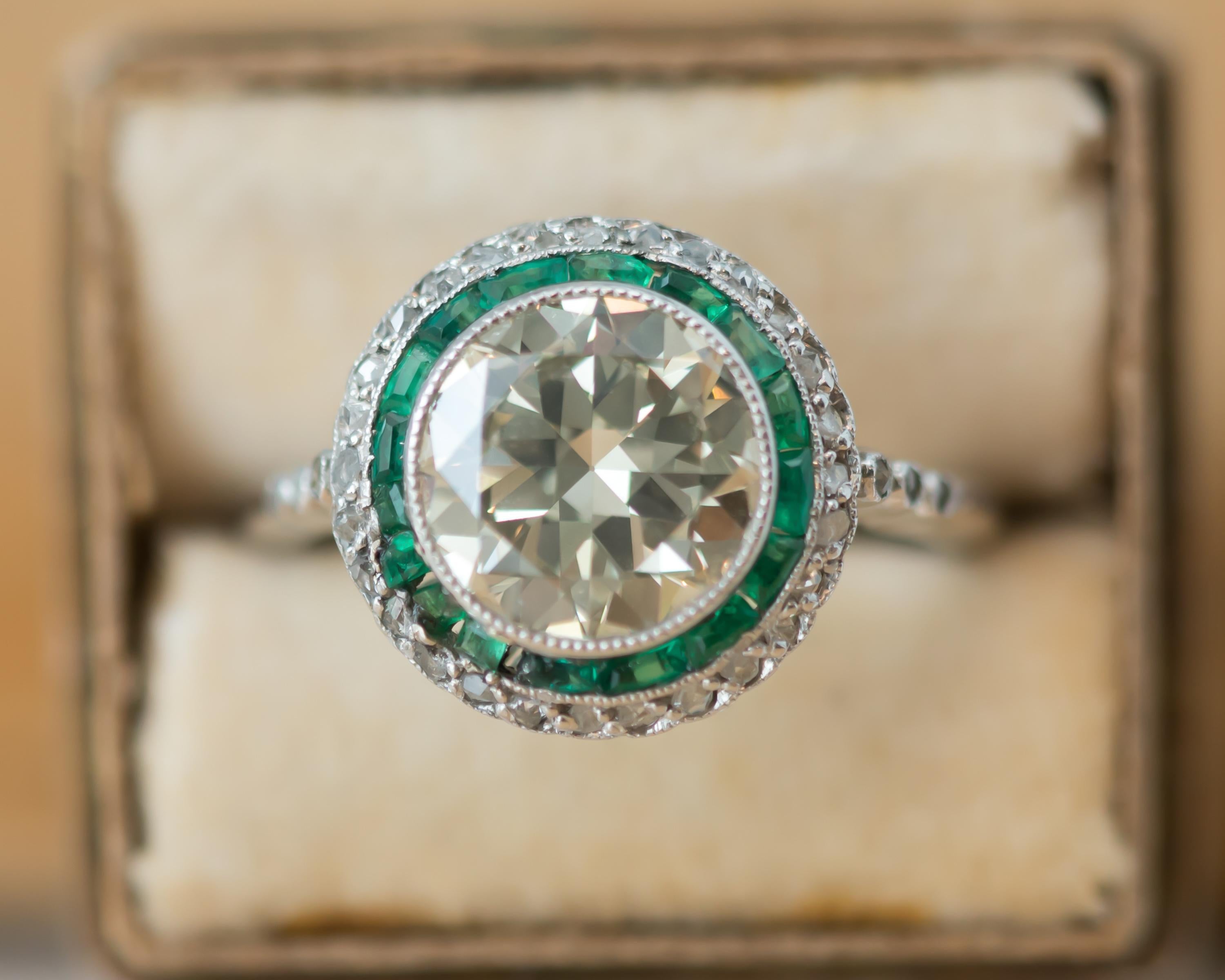 1920s Art Deco Old European Diamond, Emerald and Diamond Halo and Platinum Ring 2