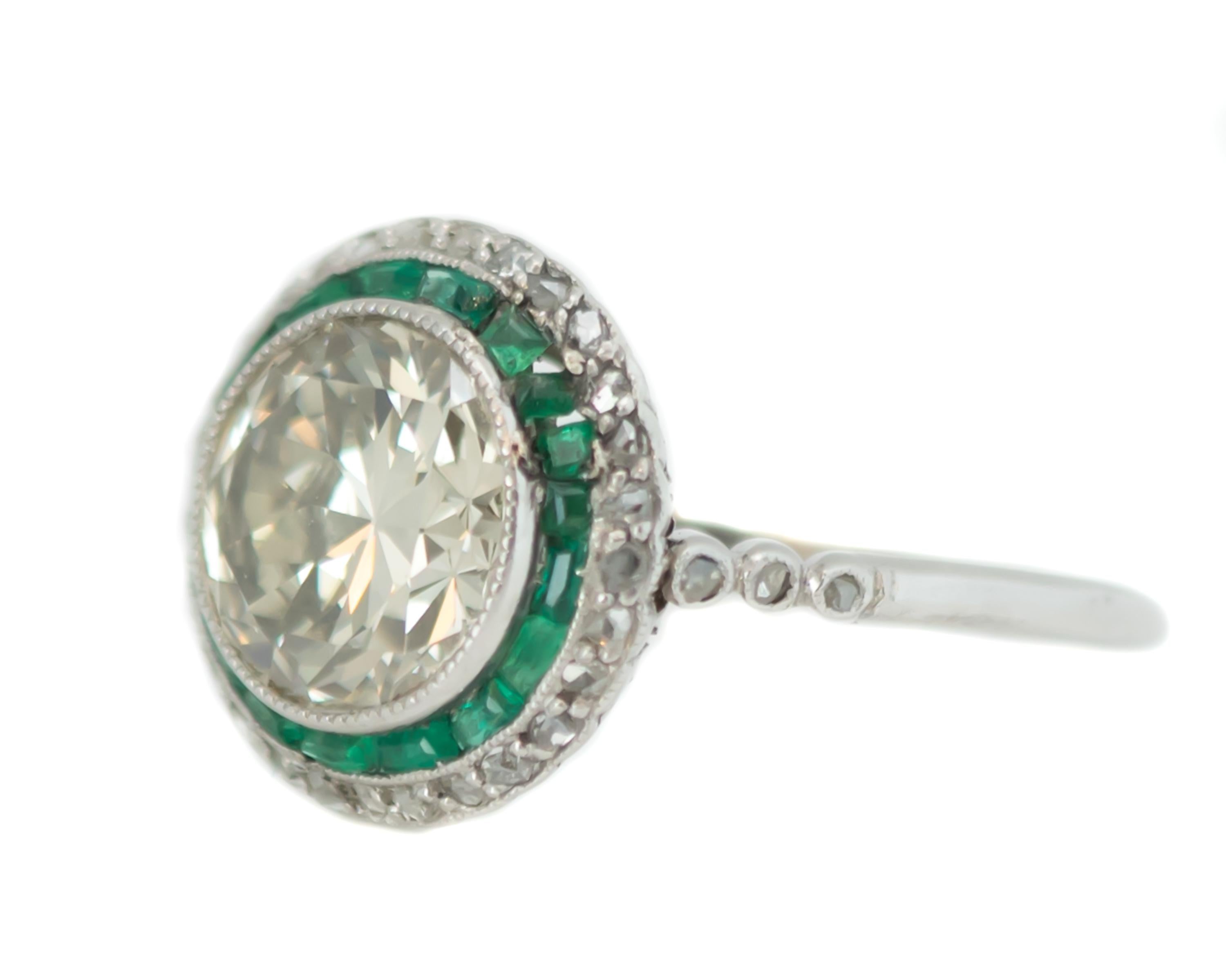 Old European Cut 1920s Art Deco Old European Diamond, Emerald and Diamond Halo and Platinum Ring