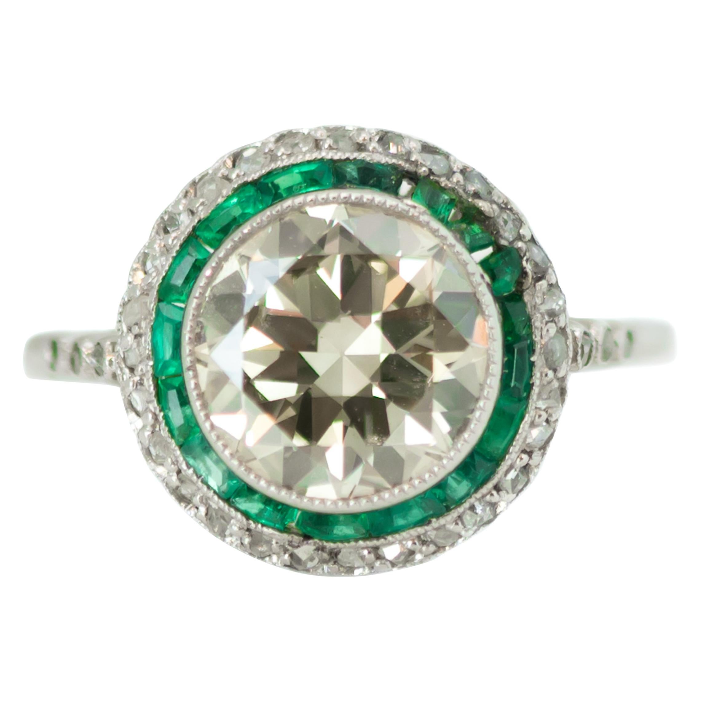 1920s Art Deco Old European Diamond, Emerald and Diamond Halo and Platinum Ring