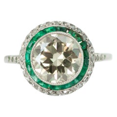 1920s Art Deco Old European Diamond, Emerald and Diamond Halo and Platinum Ring