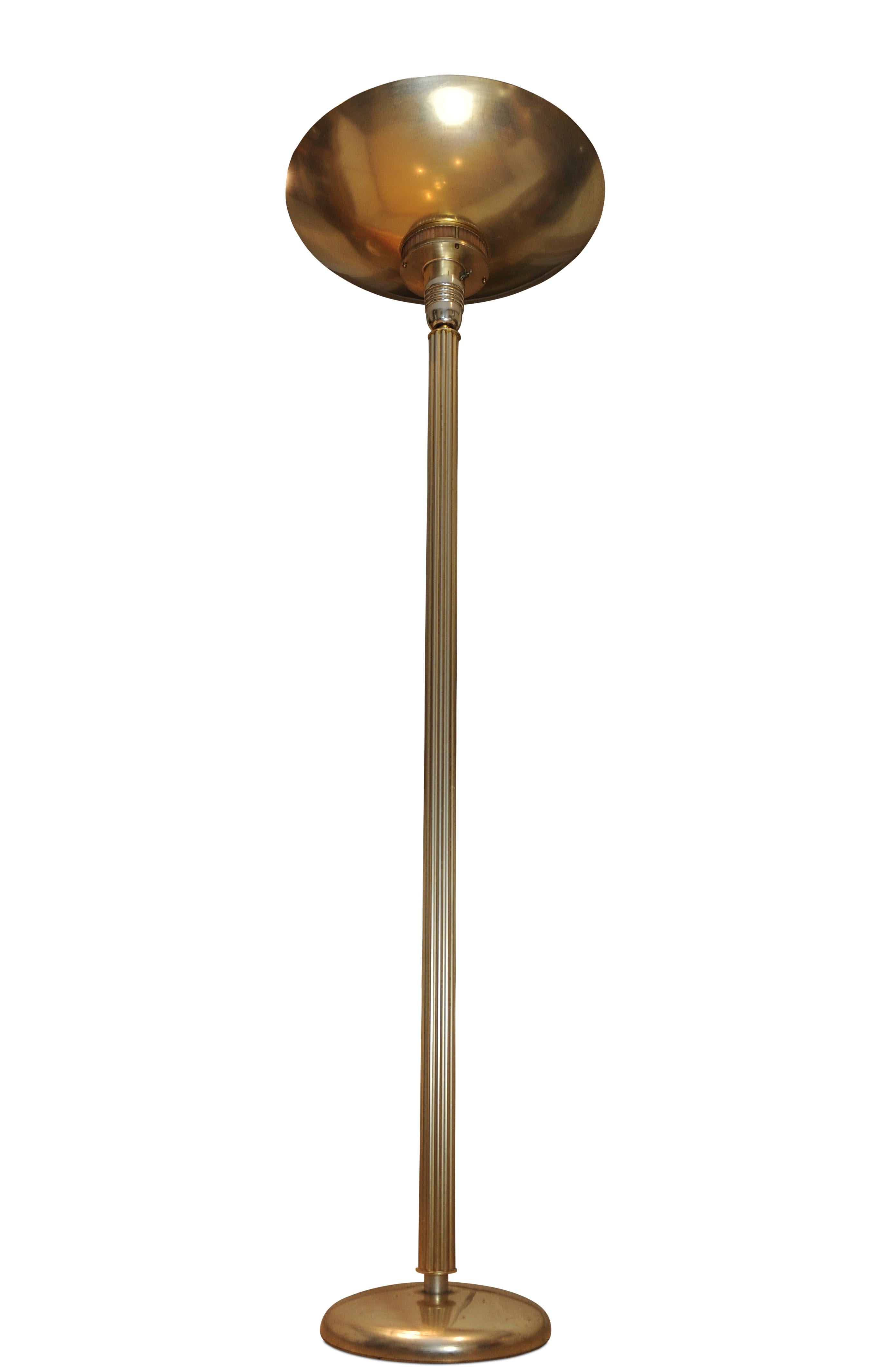 An Original 1920's Statuesque Art Deco Aluminium Floor Lamp with A Fluted Columnar Centre & Large Dished Uplighter.

Featuring An Attractive Amber Glass Band That Illuminates When Lamp is Switched On.

Retailed by Heals of London

Metal toggle