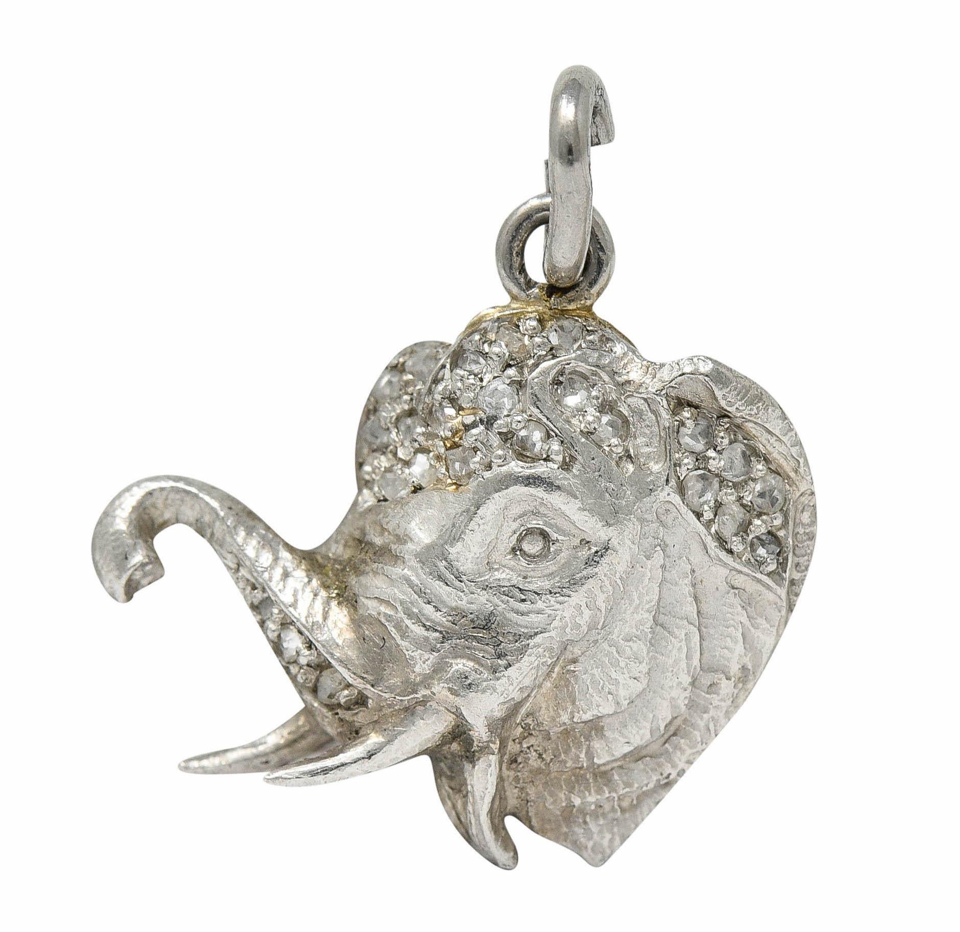 Charm is designed as a highly rendered elephant bust

With tusks, realistically wrinkled skin, and an upturned trunk

Crown is accented by rose cut diamonds weighing approximately 0.30 carat

With maker's mark and tested as platinum

Circa: