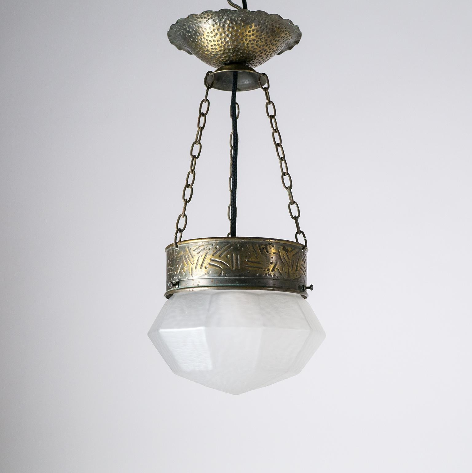 Fine early Art Deco pendant or lantern, circa 1920 (1910s). Hammered and brass-plated steel combined with a 10-sided 